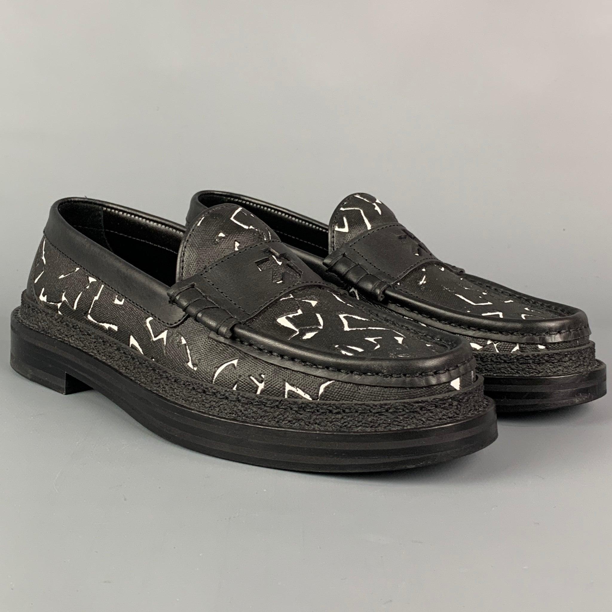 JIMMY CHOO x Eric Haze Collection Curated by Poggy Limited Edition loafers comes in a black & white coated cotton featuring a front strap, slip on, and a leather sole. Made in Italy.
Excellent
Pre-Owned Condition. 

Marked:   37.5Outsole: 10.75