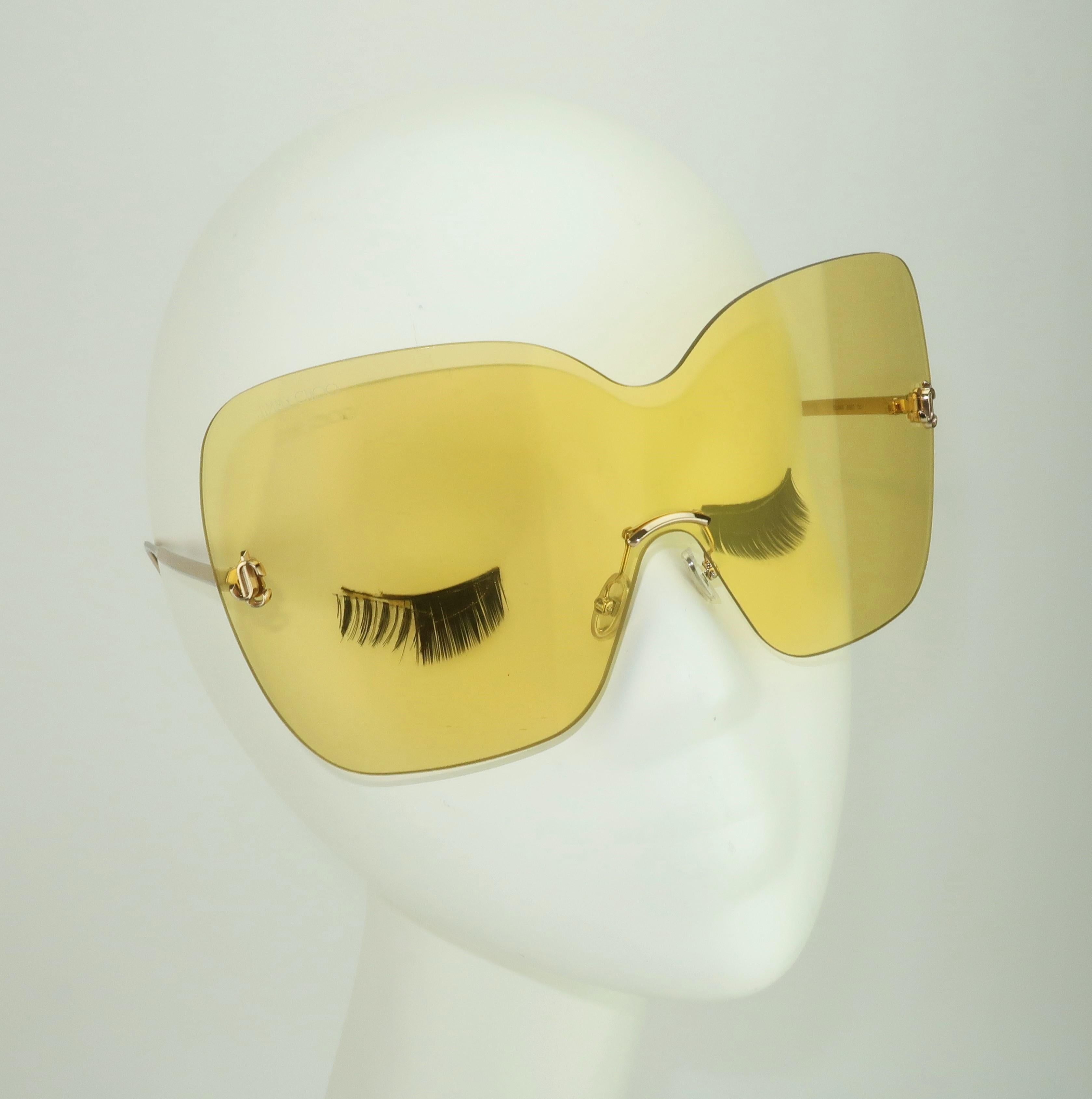 Sporty & chic!  Fabulous contemporary Jimmy Choo 'Zelma' wraparound yellow sunglasses designed with a stylistic nod to the mod 1960's.  The gold tone frame is light as air and the rimless yellow lenses, with 100% UV protection, are the perfect aid