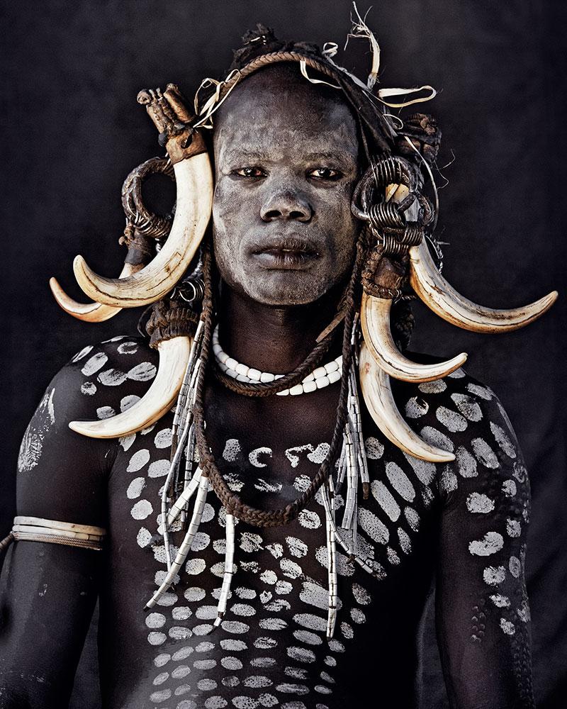 "XI 249 - Mr. Sea - Hilao Moyizo village, Omo Valley - Ethiopia, 2011

The nomadic Mursi people live in the lower area of Africa’s Great Rift Valley. Extreme drought has made it difficult for them to feed themselves by means of traditional