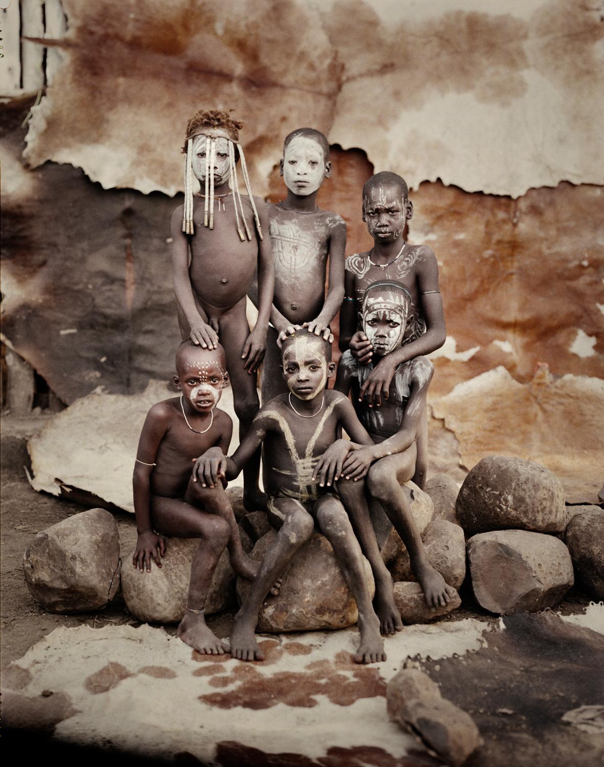 "XI 261 - Hilao Moyizo Village -Omo Valley Ethiopia, 2011

The nomadic Mursi people live in the lower area of Africa’s Great Rift Valley. Extreme drought has made it difficult for them to feed themselves by means of traditional cultivation and