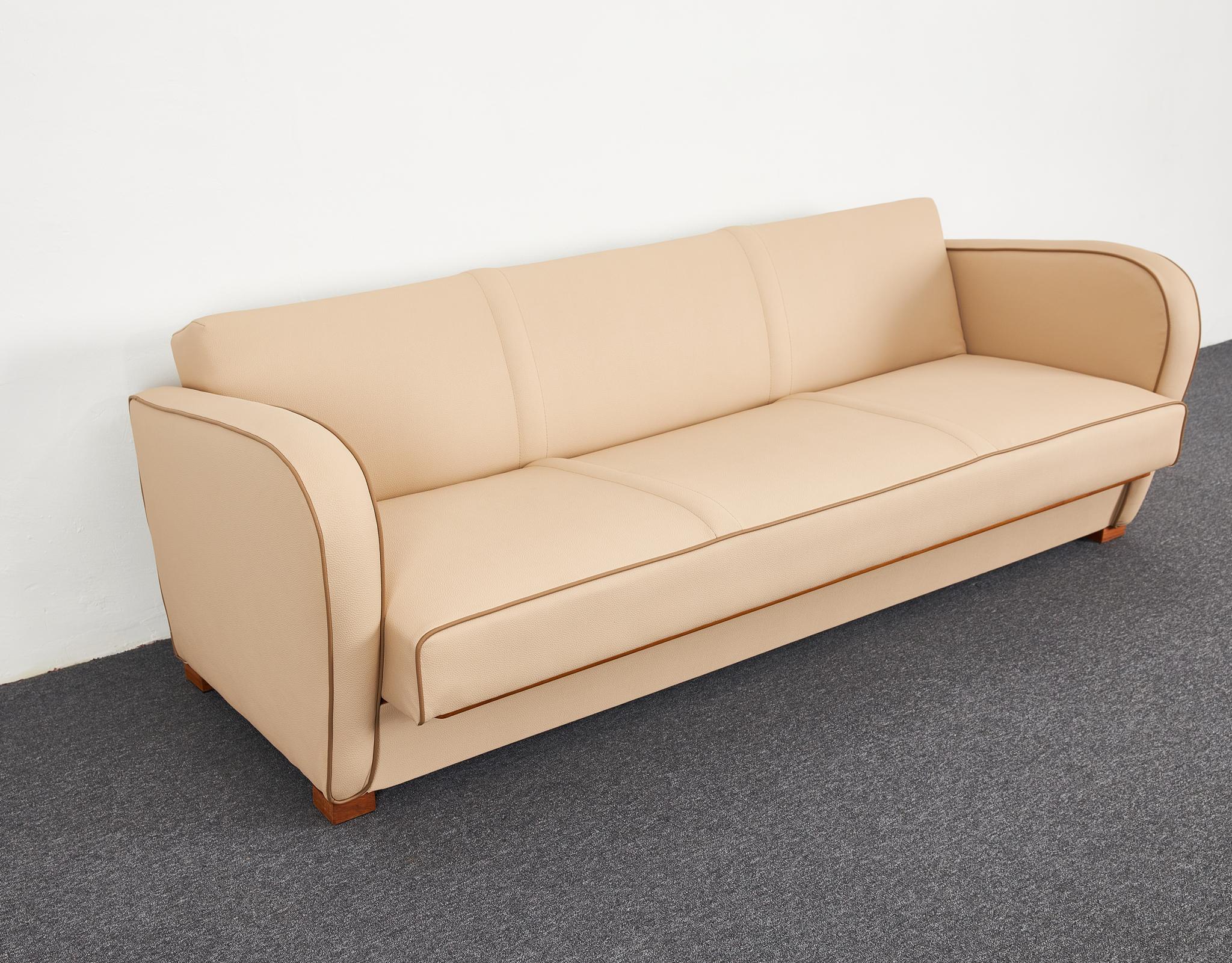 A true classic Art Deco Halabala sofa from the 1930's. Eternal design is this world of form. Its classic yet modern lines stand out in the 21st century. Completely refurbished structurally, reinforced and re-tied with original copper epeda springs,