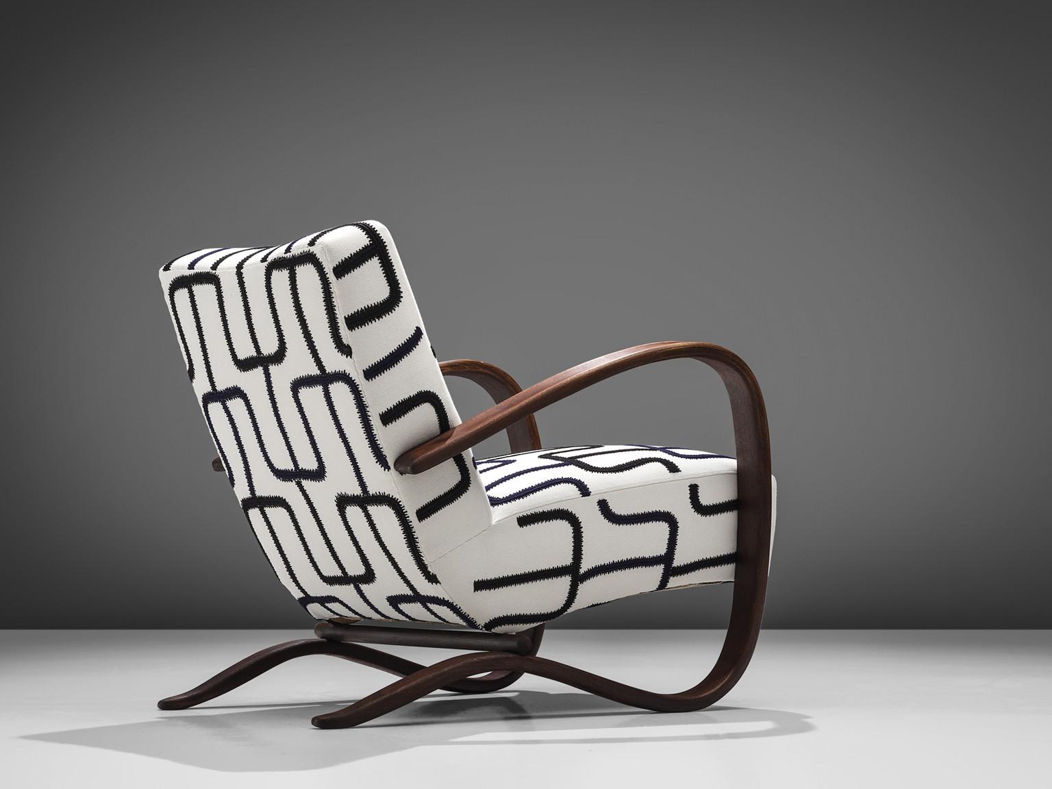 Jindrich Halabala, customizable lounge chair, wood, fabric, Czech Republic, 1930s 

Extraordinary easy chair with graphic upholstery. This chair has a very dynamic and abundant appearance. Beautifully curved armrests in a dark brown color add a