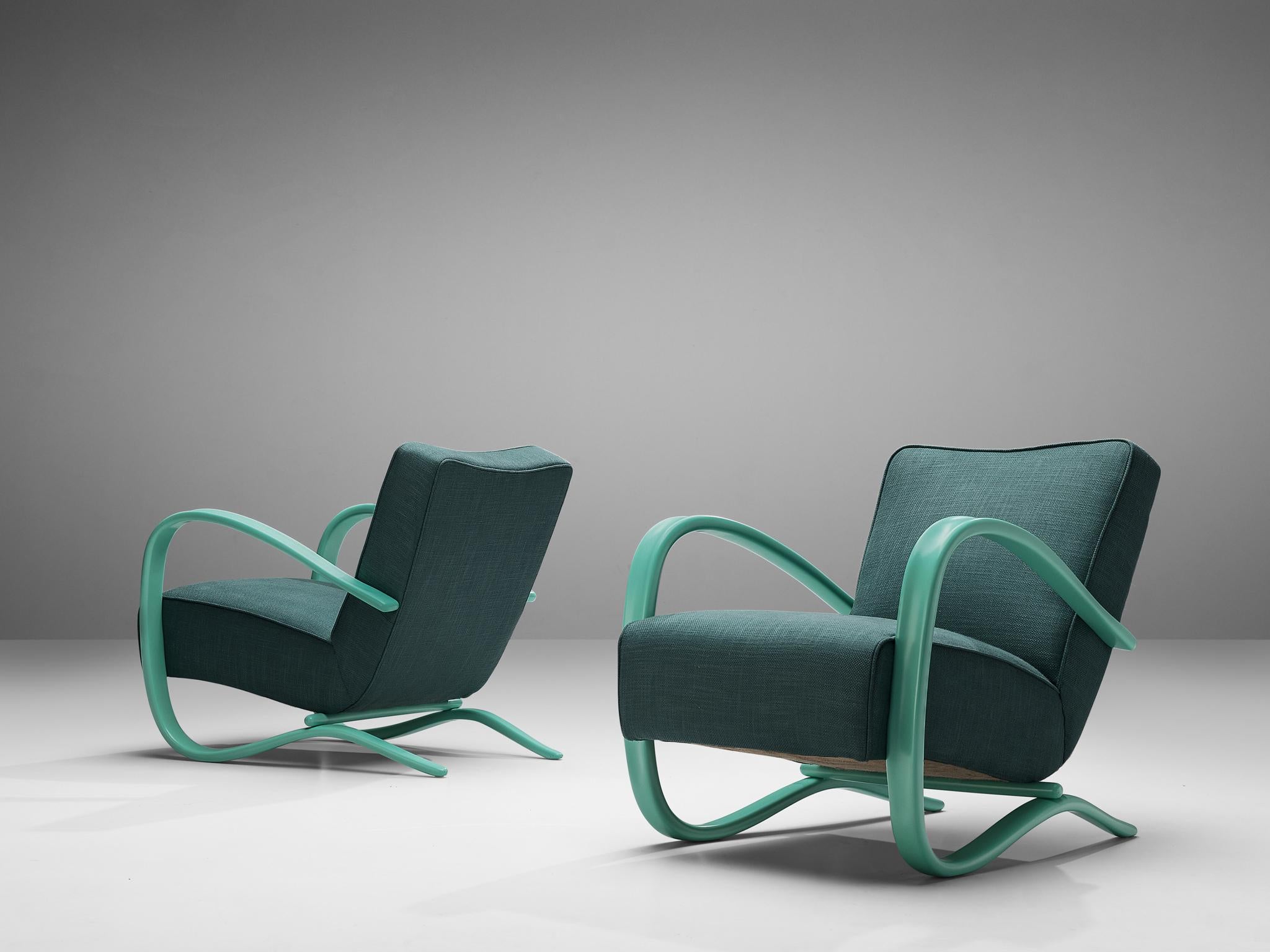 Jindrich Halabala, chaises longues personnalisables, bois, tissu, République tchèque, années 1930

Fauteuils extraordinaires avec revêtement en tissu vert. Ces chaises ont une apparence très dynamique et abondante. Les accoudoirs joliment courbés