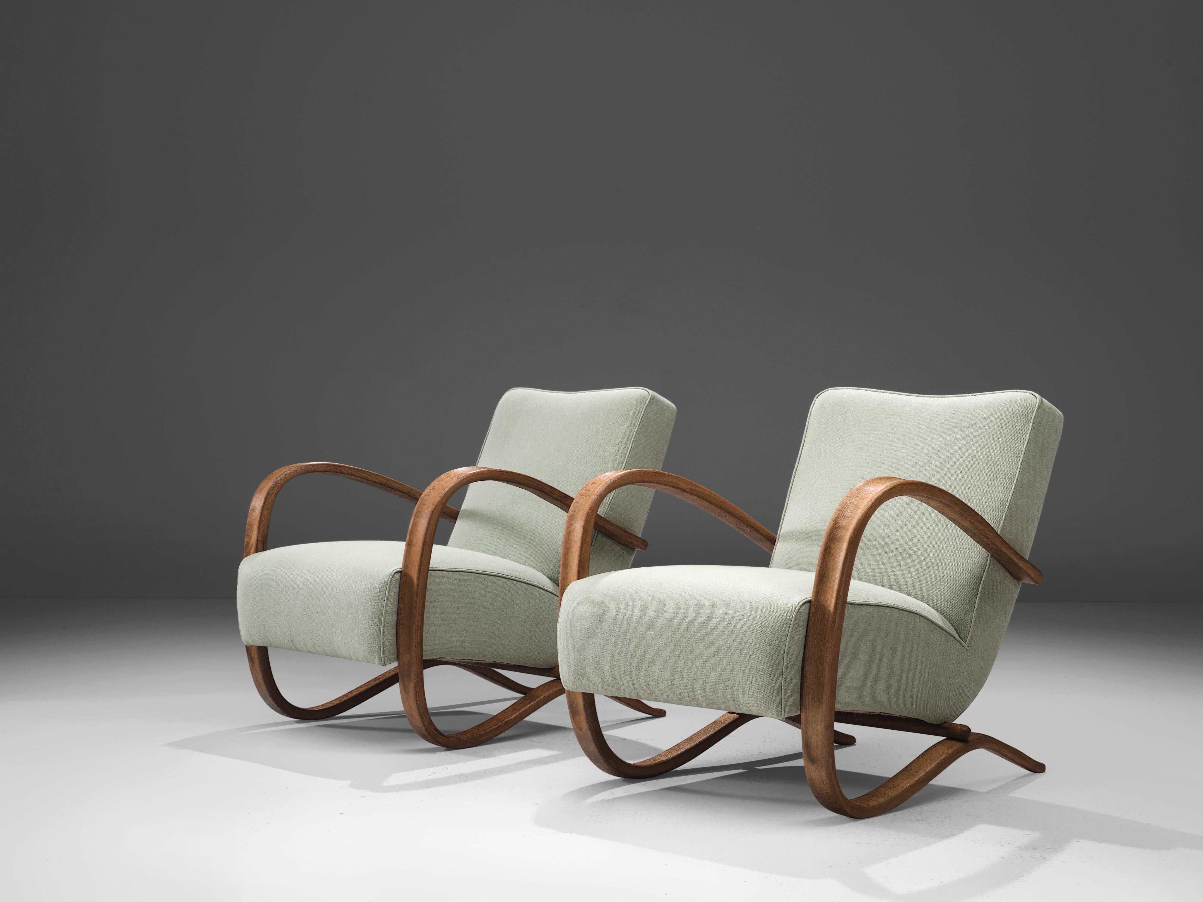 Jindrich Halabala, customizable lounge chairs, wood, fabric, Czech Republic, 1930s.

Extraordinary easy chairs with hand-crafted upholstery. These chairs have a very dynamic and abundant appearance. Beautifully curved armrests add a dynamic appeal