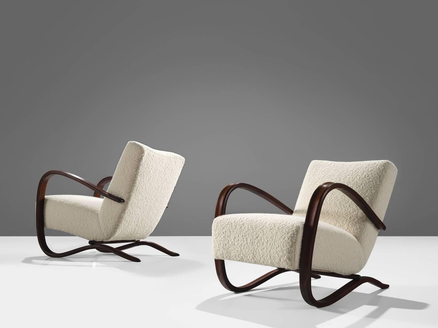 Jindřich Halabala, customizable lounge chairs, wood, Pierre Frey fabric, Czech Republic, 1930s  

Extraordinary easy chairs with Pierre Frey fabric upholstery. These chairs have a very dynamic and abundant appearance. Beautifully curved armrests in