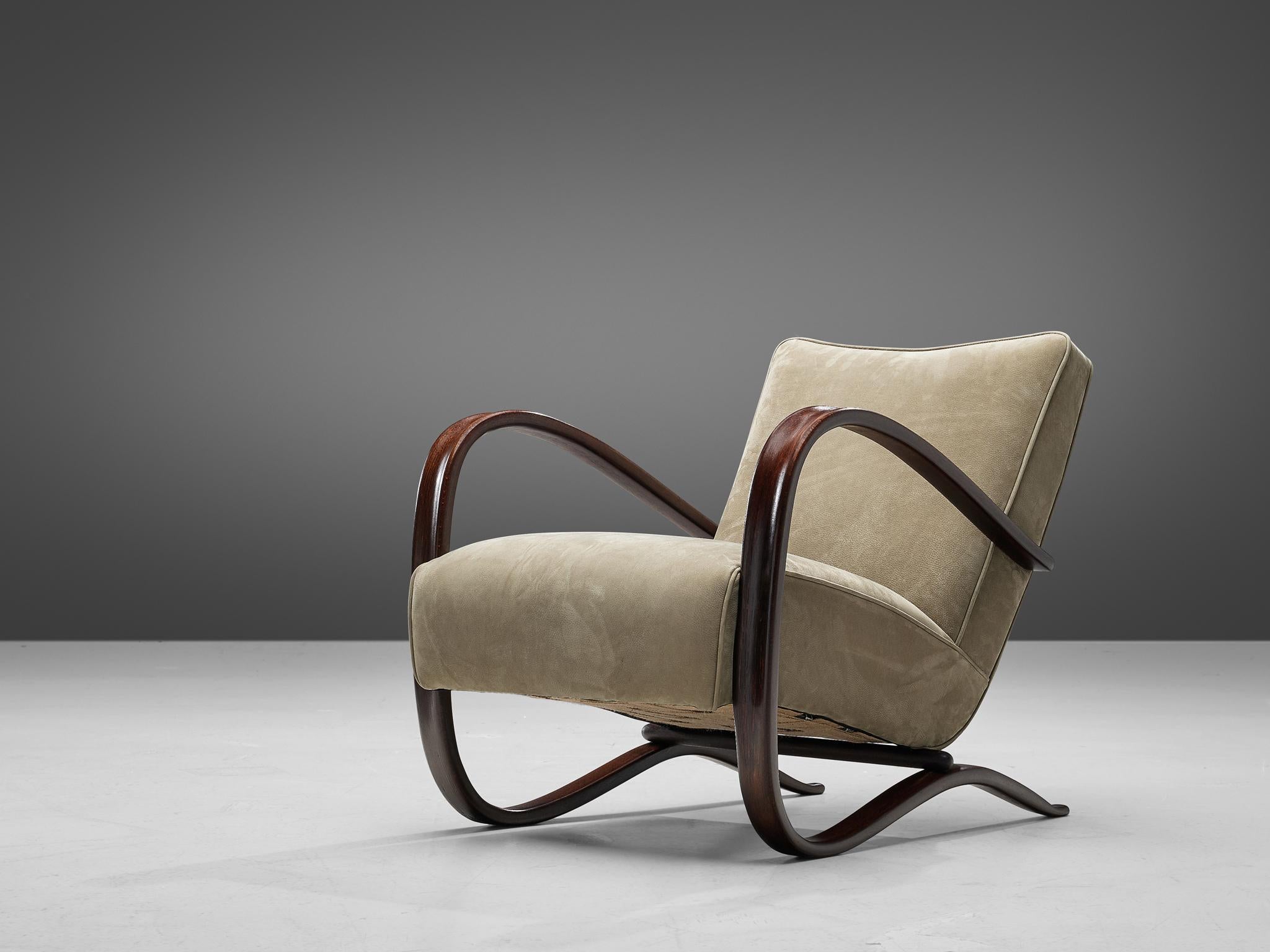 Jindrich Halabala, lounge chair, in beech and leather, by Jindrich Halabala, Czech Republic, 1930s.

This extraordinary Halabala chair is upholstered with a soft green leather upholstery in our upholstery studio. This chair has a very dynamic
