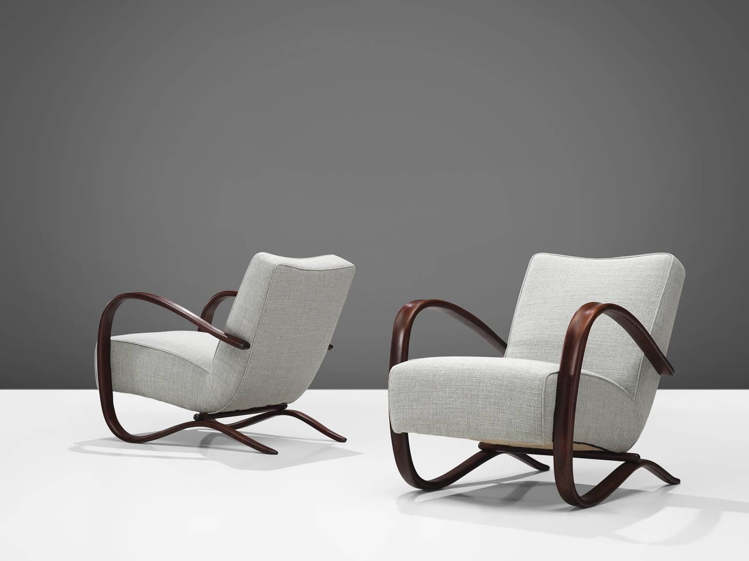 Jindrich Halabala, lounge chairs, grey fabric and stained beech, Czech Republic, 1930s. 

This extraordinary pair of Halabala chairs is part of our customized midcentury design collection. The easy chairs are upholstered with grey - off white