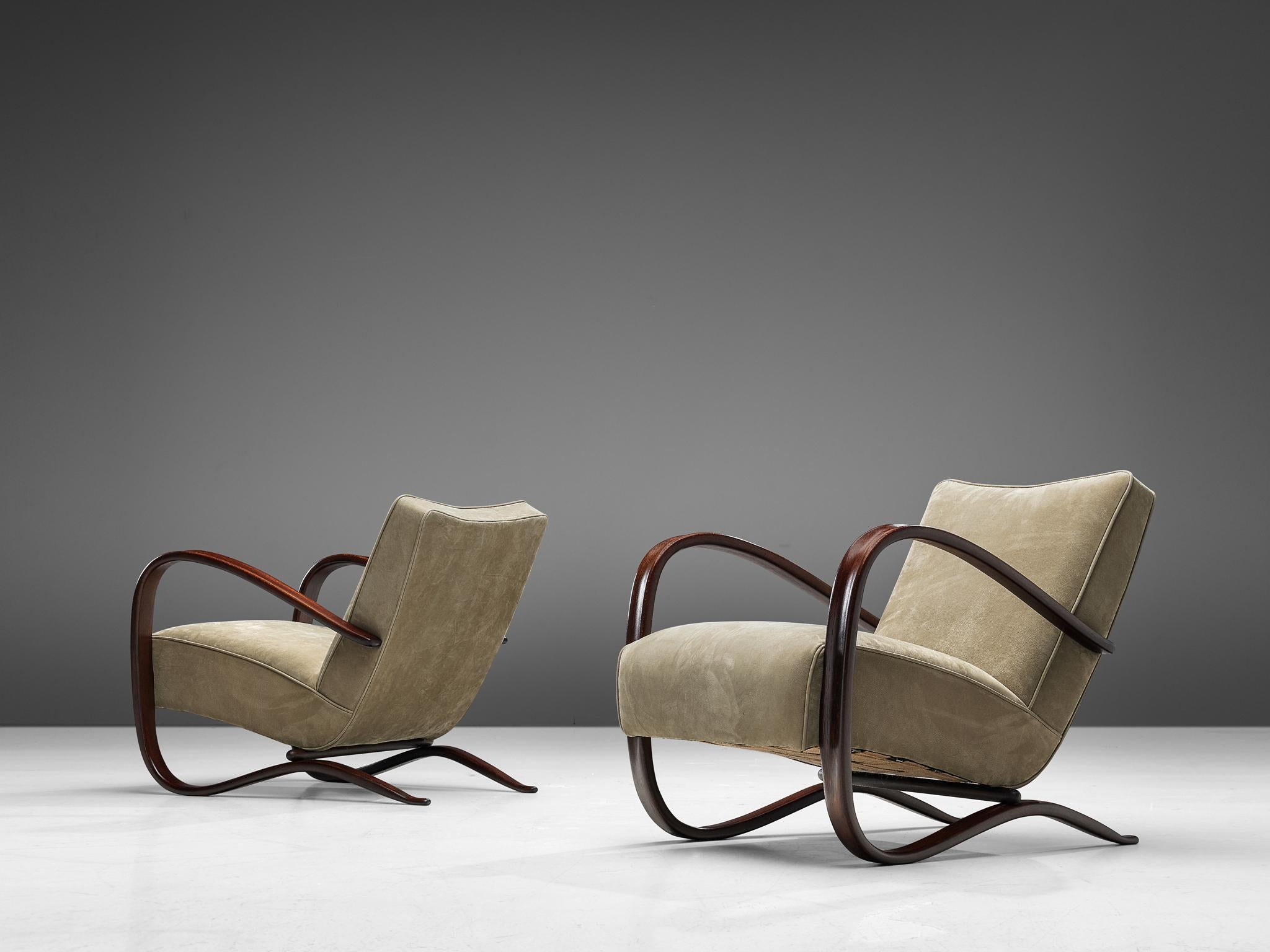 Jindrich Halabala, lounge chairs, in beech and leather, Czech Republic, 1930s.

This extraordinary pair of Halabala chairs are upholstered in a high quality leather in our upholstery studio. These chairs have a very dynamic appearance. Beautifully