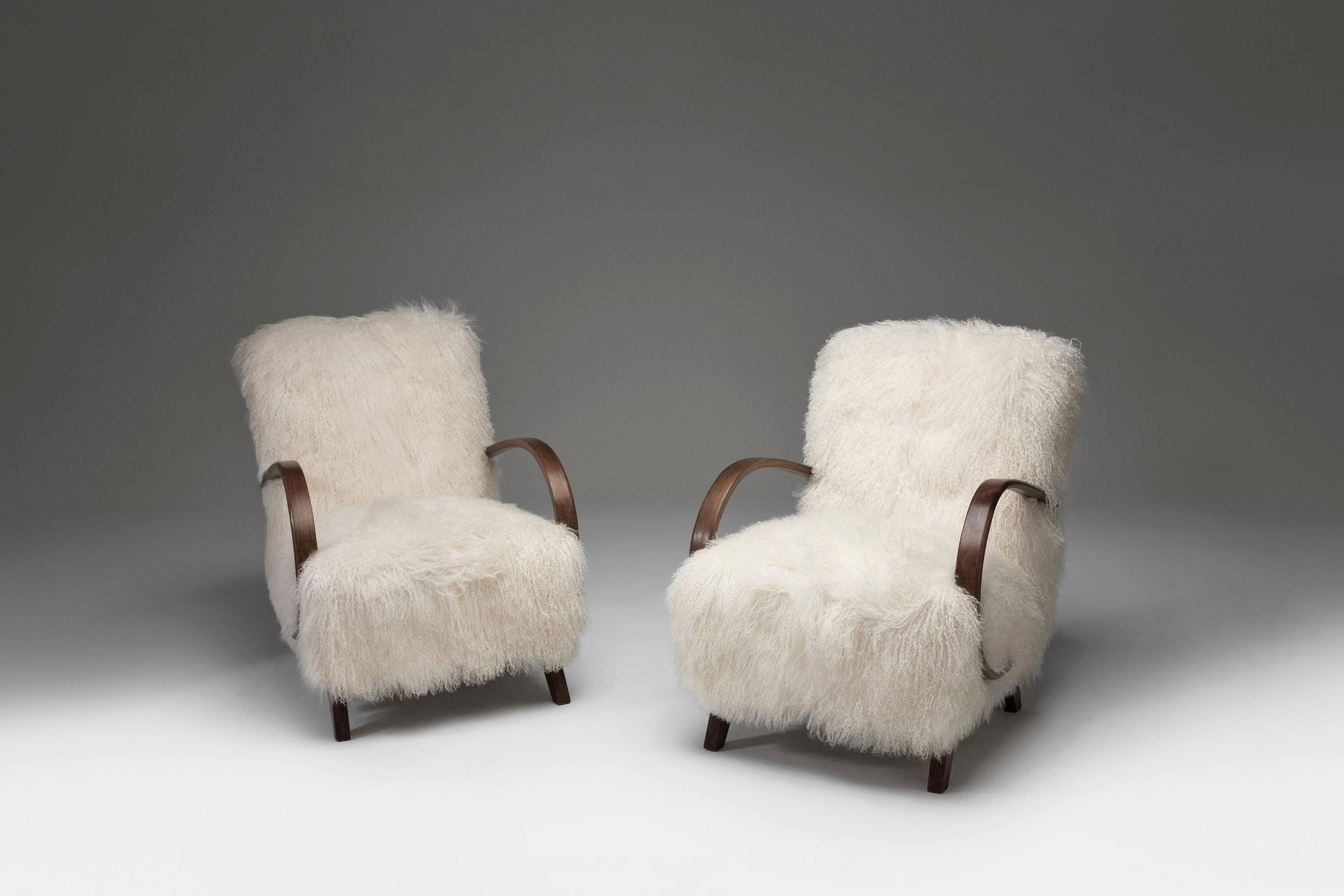 Jindrich Halabala armchairs model “C”, Czech Republic, 1930s.

Amazing armchairs upholstered in white Tibetan lambswool with curly hair.

These chairs have a dynamic and generous appearance, together with beautiful, fuzzy and coziness upholstery