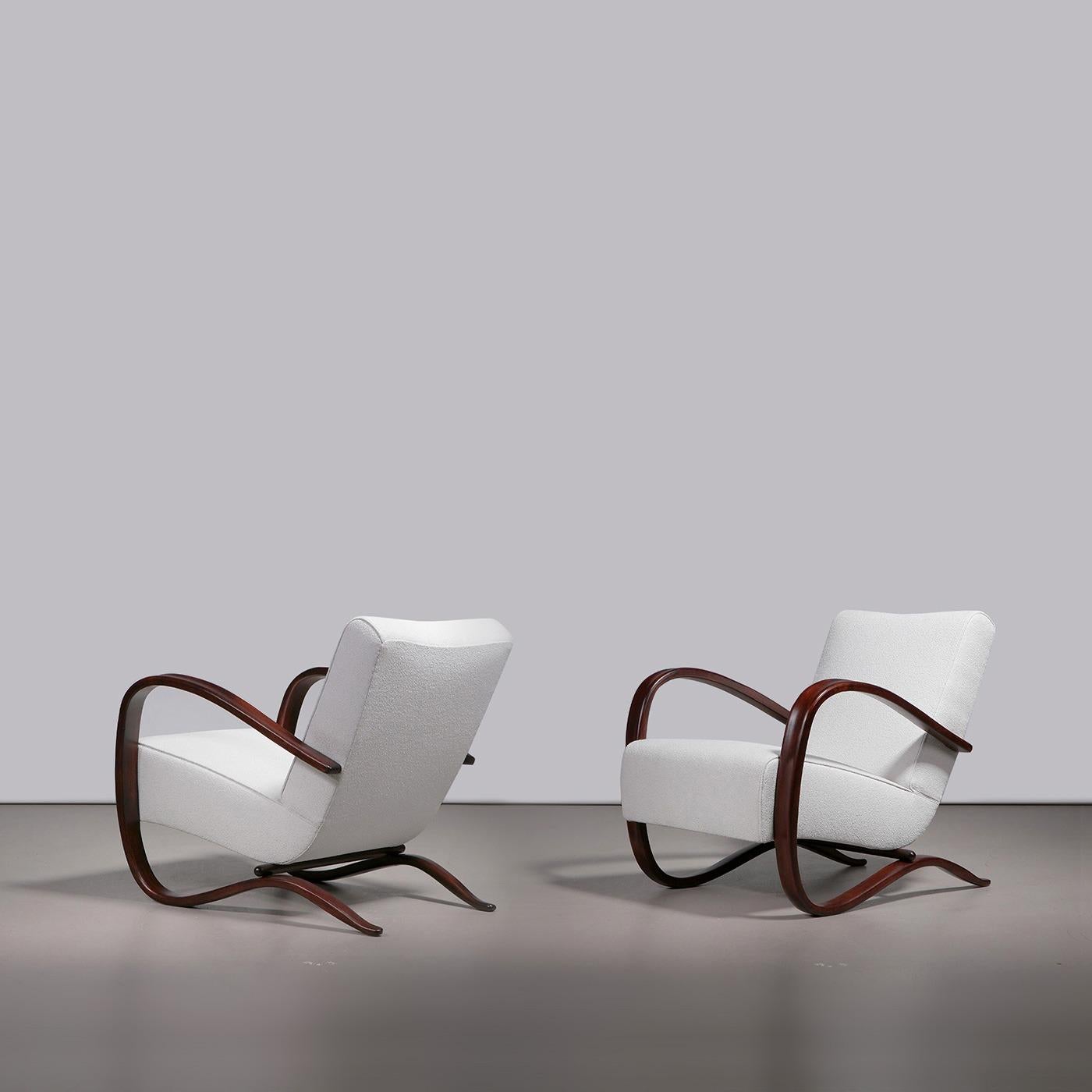 Jindřich Halabala for UP Závody, pair of model 'H-269' armchairs, wood, fabric upholstery, former Czechoslovakia, 1930s.

One of the best-known lounge chair models by the renowned Czech designer, the 'H-269' model designed for UP Závody features a