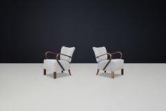 JIndrich Halabala re-upholstered patinated bentwood lounge chairs from the 1930s