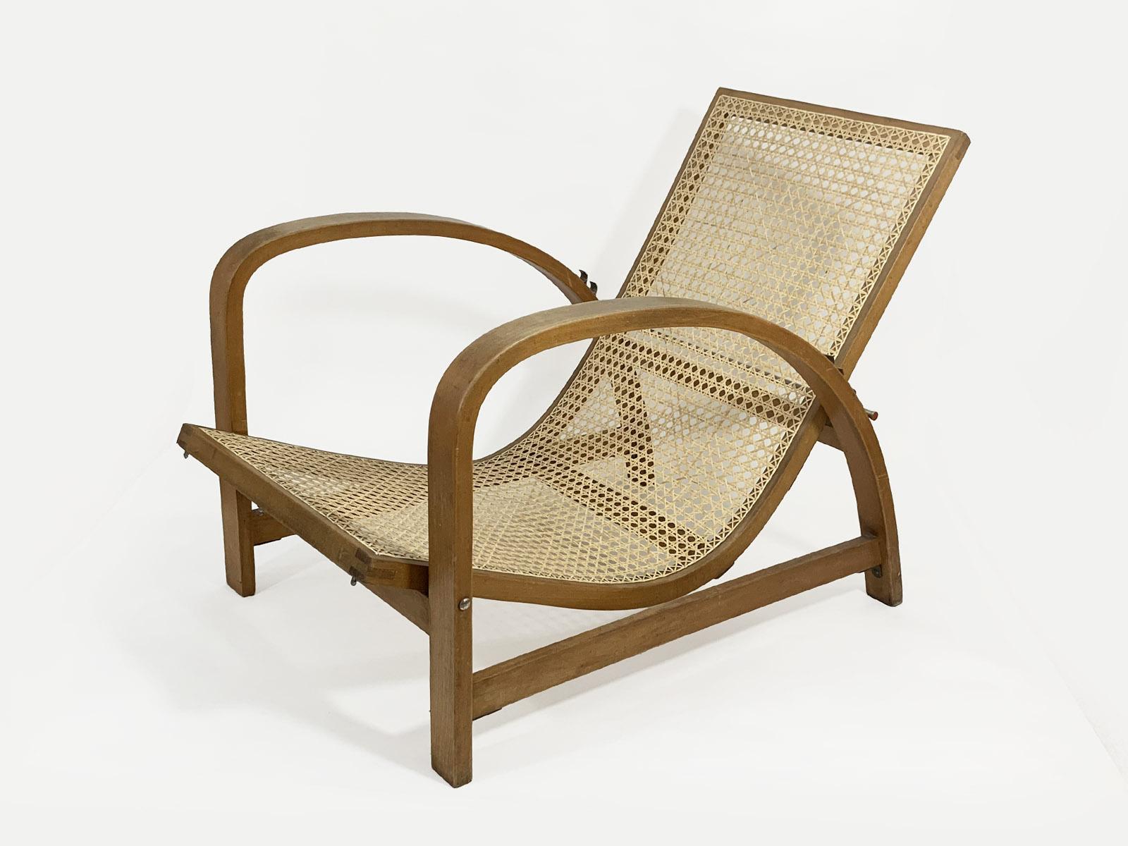 Beech wood and cane reclining chair by Jindrich Halabala, Czechoslovakia, 1930s.
Produced by Fischel.
Original condition, cane restored. We also have the original seat cover for this chair that can be restored for you, please ask for additional