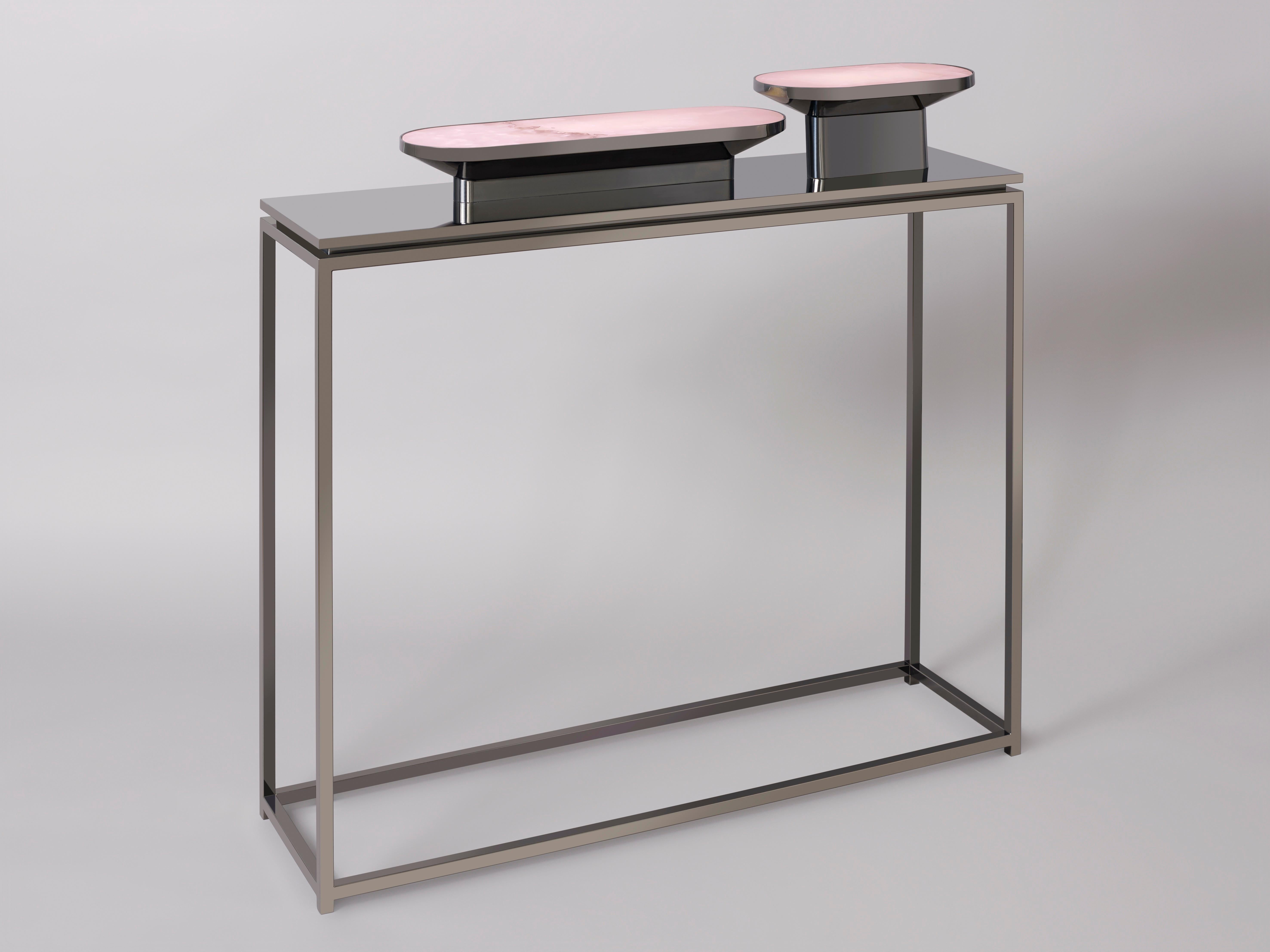This 'JinShi Pink Jade' glamorous console by acclaimed design duo Studio MVW is a true jewel for the home. The mirror encompasses two retro-lit heads in natural pink jade, an exceptional gemstone with a sumptuous powder transparency, and a structure