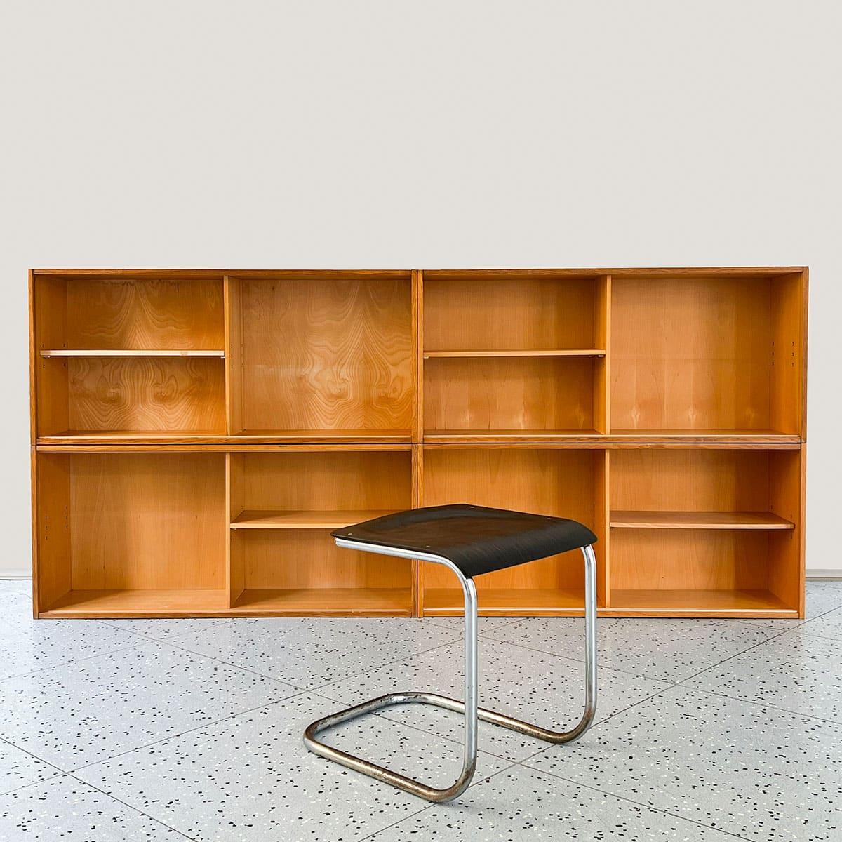 Demountable plywood cabinet or bookshelf designed by Jirí Jiroutek and manufactured by Interier Praha in former Czechoslovakia, 1960s.

This unique cabinet consists of four smaller U-470 shelves held together by metal pins. Put together, these