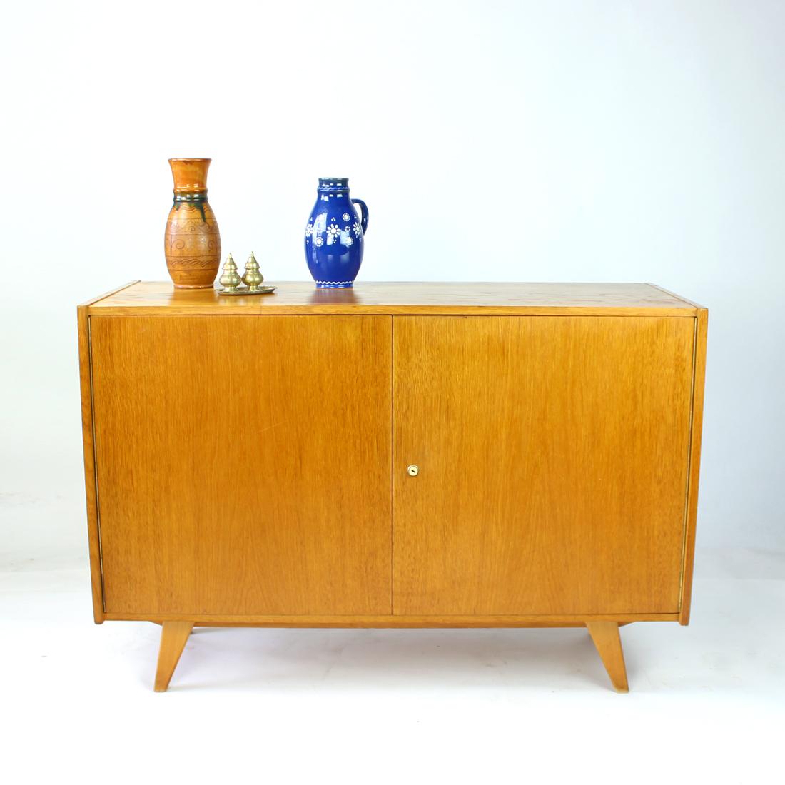 Iconic sideboard produced as a U450 Model by Interier Praha in 1960s. Designed by Jiri Jiroutek. Original label still attached in a beautiful condition on the back. The sideboard has been partially restored, the top board and wooden frame has been