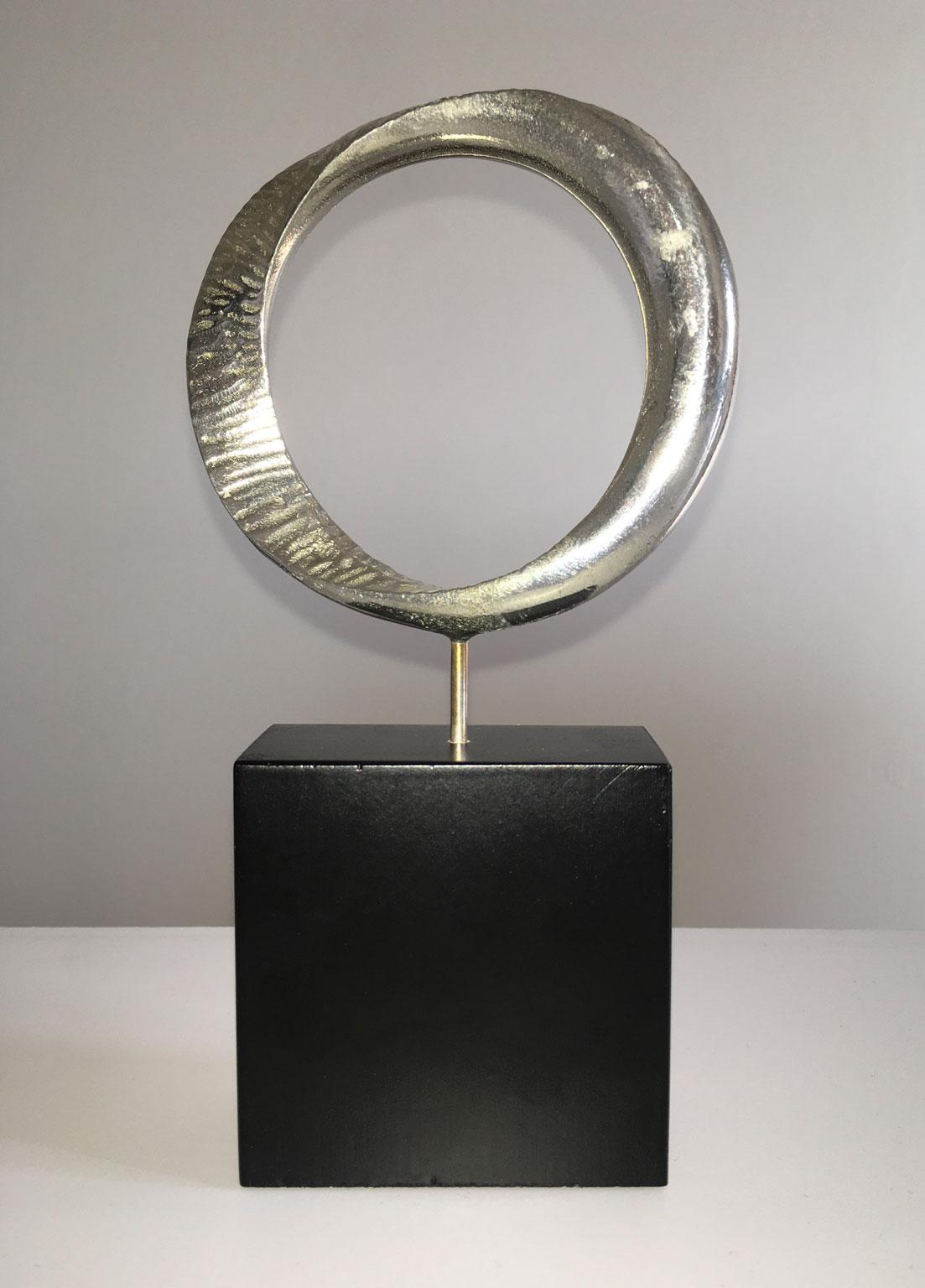 This artwork was created by the artist Jiro Sugawara, the title is "Circle"
Jiro Sugawara is a post-war artist and he was born in Japon in 1941. He studied sculpture at the Tokyo Department of 
Art and Sculpture.
He won numerous prizes in Japan and