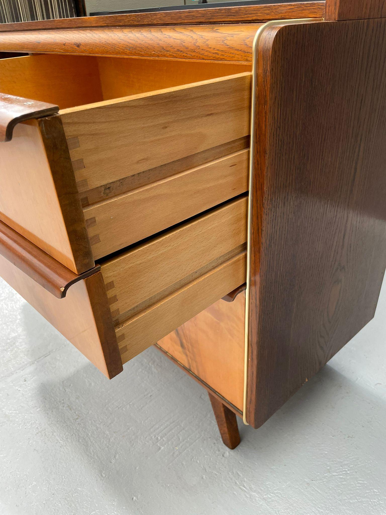 Stylish vintage design sideboard created by renowned Czechoslovak designers Bohumil Landsman and Hubert Nepožitek for the national furniture company Jitona, factory Soběslav – Lišov, during the 1960s.
This elegant cabinet features signature