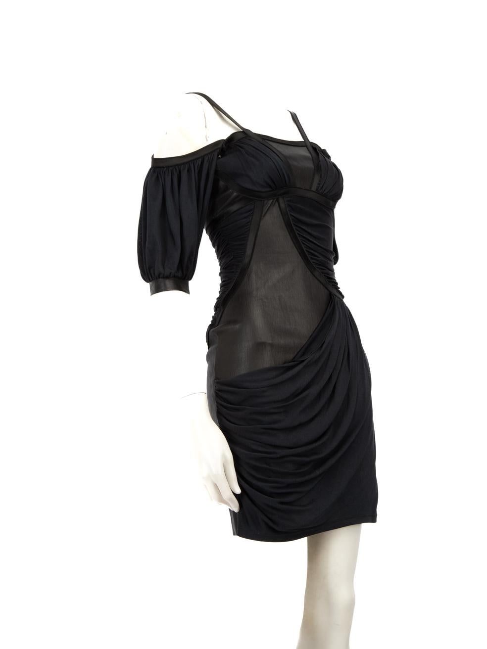 CONDITION is Very good. Minimal wear to the dress is evident. Plucks to the weave on the right side of the front drape, on the left sleeve and on the centre back. Abrasion to the leather on the left sleeve. Loose stitching on the front and back hem