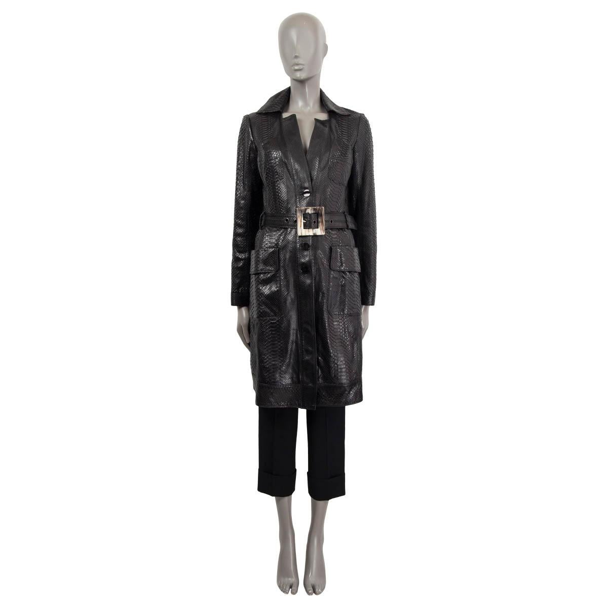 100% authentic Jitrois belted coat in black python (100%). Features four patch pockets on the front and a belt with a horn buckle. Three buttons on the arm and a slit. Opens with buttons on the front.Lining acetate (100%). Has been worn and is in