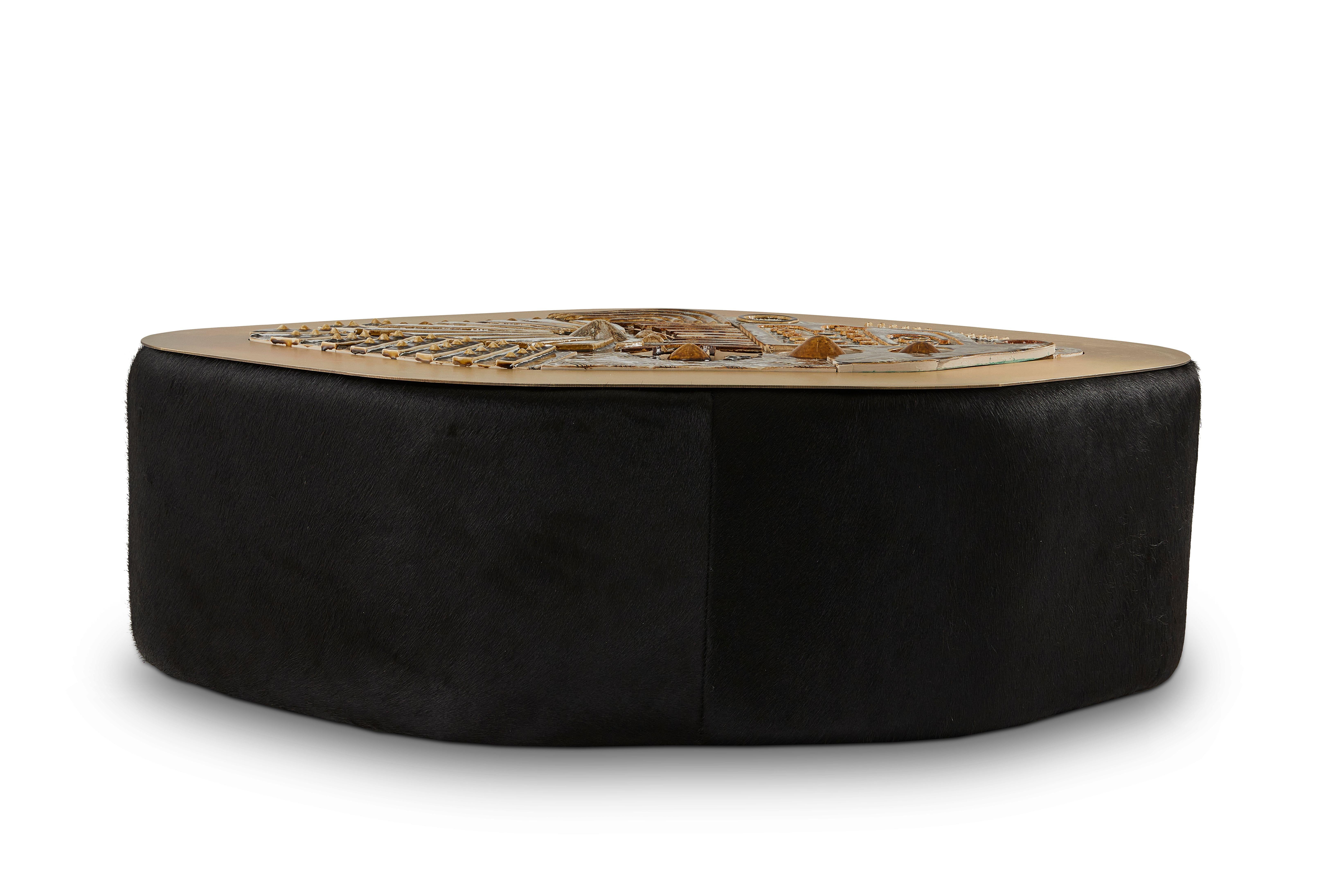 Jive coffee table by Egg Designs
Dimensions: 122 L X 85 D X 49 H cm
Materials: Handmade Ceramic Mural, Bronze Plated Steel, Black Hair On Hide

Founded by South Africans and life partners, Greg and Roche Dry - Egg is a unique perspective in