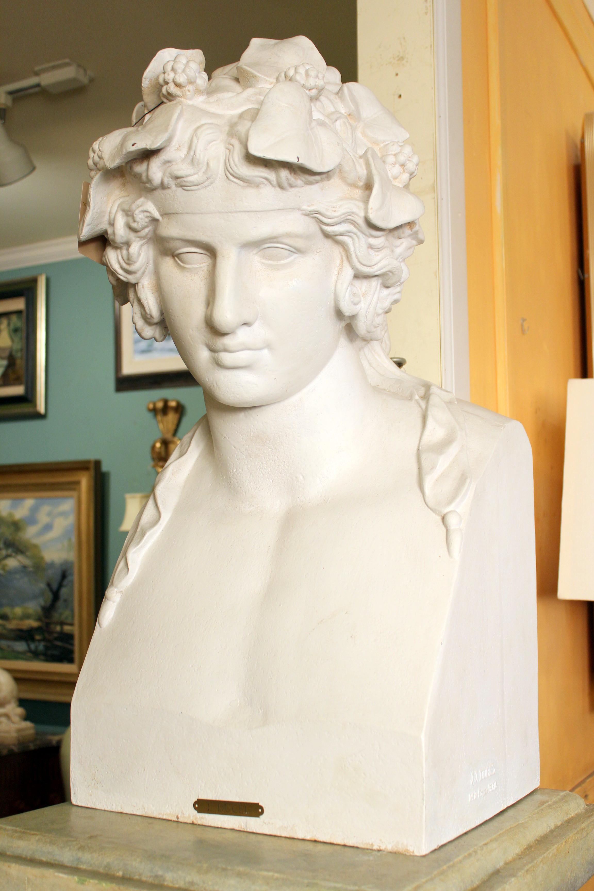 19th century painted cast iron and  bust by noted Parisian foundry and retailer J.J. Ducel (1810-1878) and painted faux marble pedestal. The painted pedestal was made in the U.S. circa 1990. Dimensions of cast iron bust, height 29