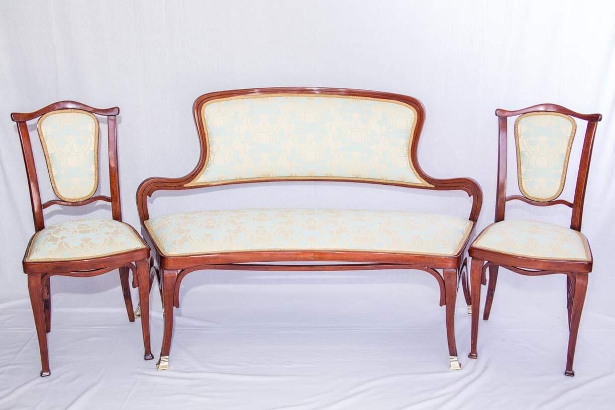 This beautiful bench was designed by Gustav Siegel, J & J Kohn. In 1900 in Paris there was a world exhibition of furniture made by Kohn to see the photos attached, photographed in 1906 catalog. You can see on rights down said to the foto. That's why