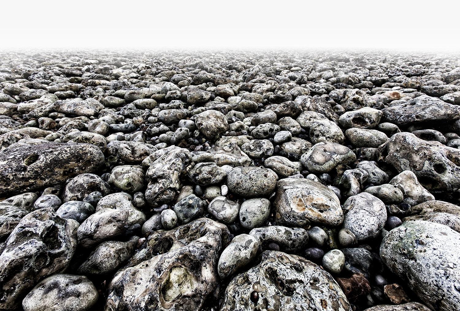 Edition of 25
signed and numbered by the artist

Stones at low tide on the beach in Normandy. They look like skulls that have been picked up.

JJK is a pseudonym for one of the world's most successful photo artists.
In his series "Always in my