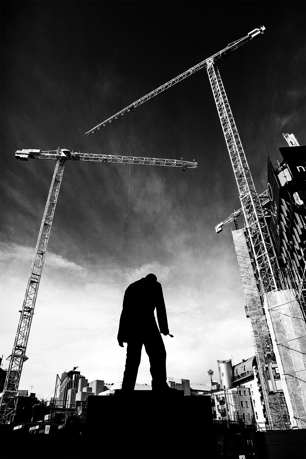 Edition of 25
signed and numbered by the artist

This photo was shot in Berlin. The cranes make the statue looks like a marionette.

JJK is a pseudonym for one of the world's most successful photo artists.
In his series "Always in my mind", he