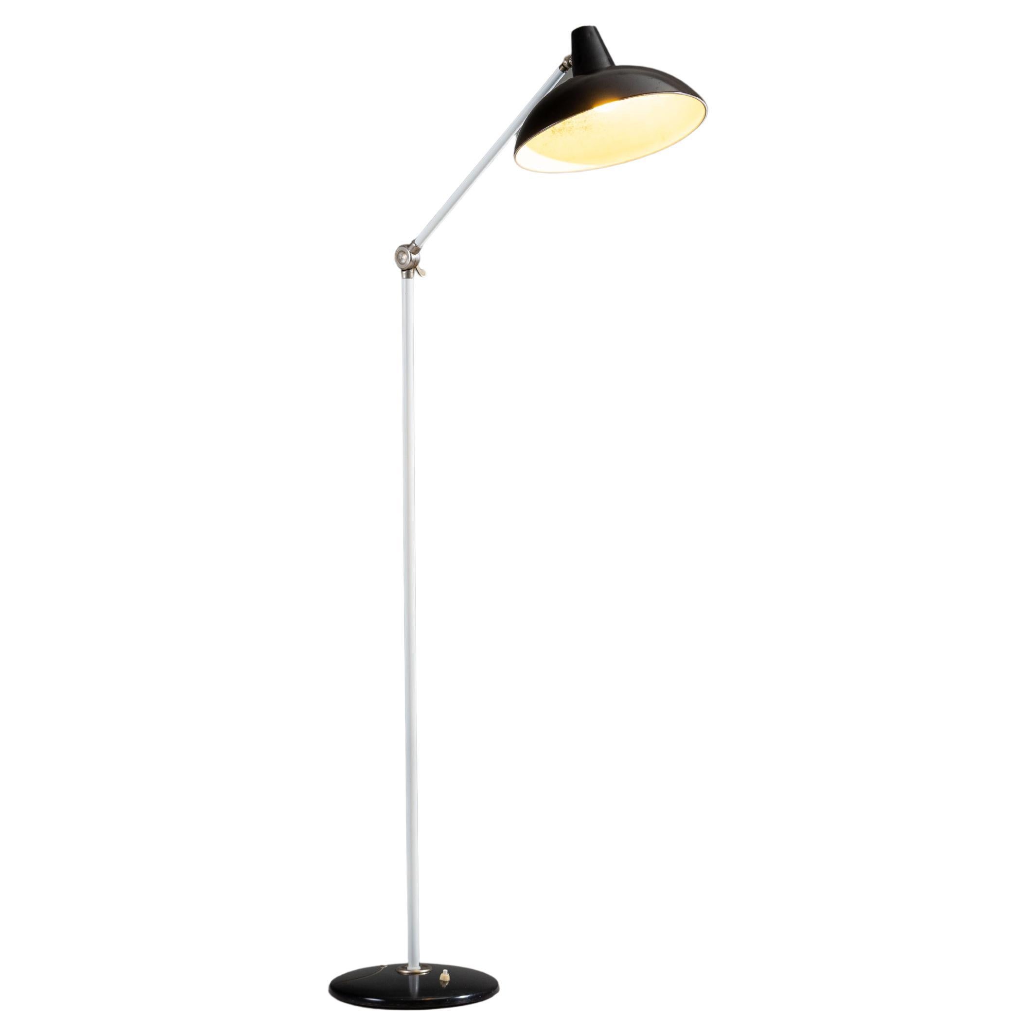 Beautiful floor lamp designed by J.J.M. Hoogervorst for Anvia, Almelo, The Netherlands 1950. A quintessential example of Dutch mid-century modern lighting, the lamp combines elegant geometry with functional precision.

The design features a black