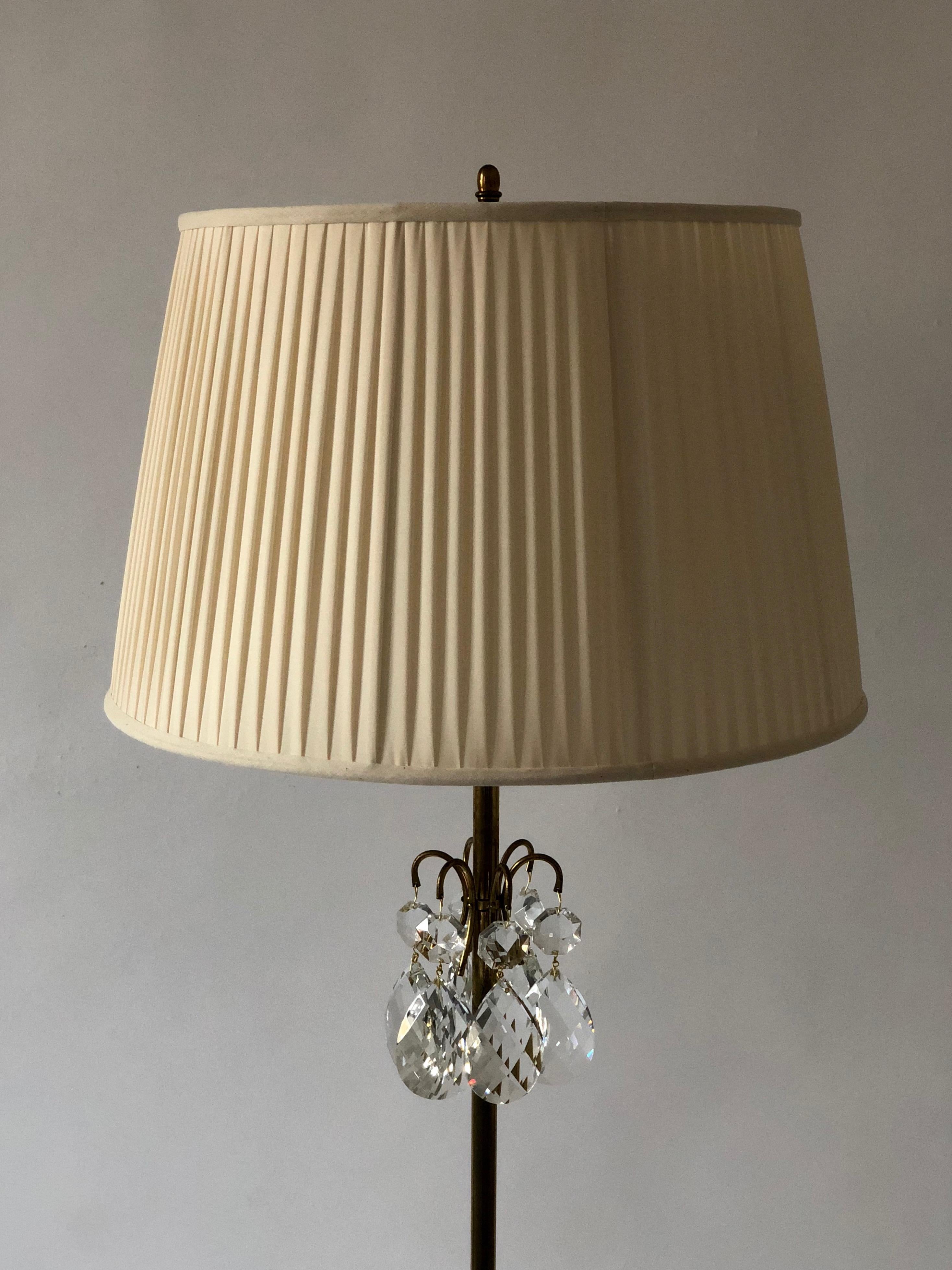 A beautiful example of a Lobmeyr brass floor lamp with hand ground crystal glass elements combined
with detailed metal work. The silk shade is new as is the electrical wire.
I hope that the photos give your insight to the elegance represented here.