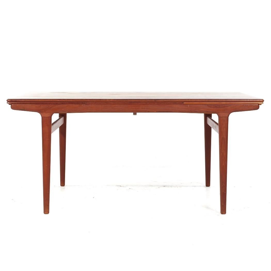 JL Moller Mid Century Danish Teak Hidden Leaf Expanding Dining Table

This table measures: 63 wide x 38.75 deep x 28.25 high, with a chair clearance of 24.75 inches, each hidden leaf measures 19.5 inches, making a maximum table width of 102 inches