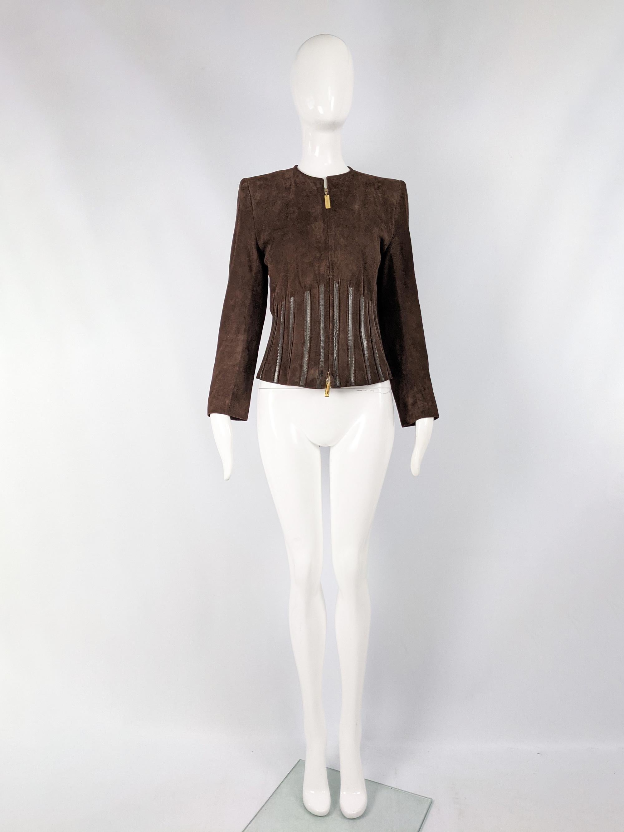 An ultra chic womens vintage suede jacket from the 80s by luxury French fashion designer and couturier, Jean Louis Scherrer for his leather line. In a brown suede with black leather appliques and small shoulder pads for an edgy silhouette. 

Size: