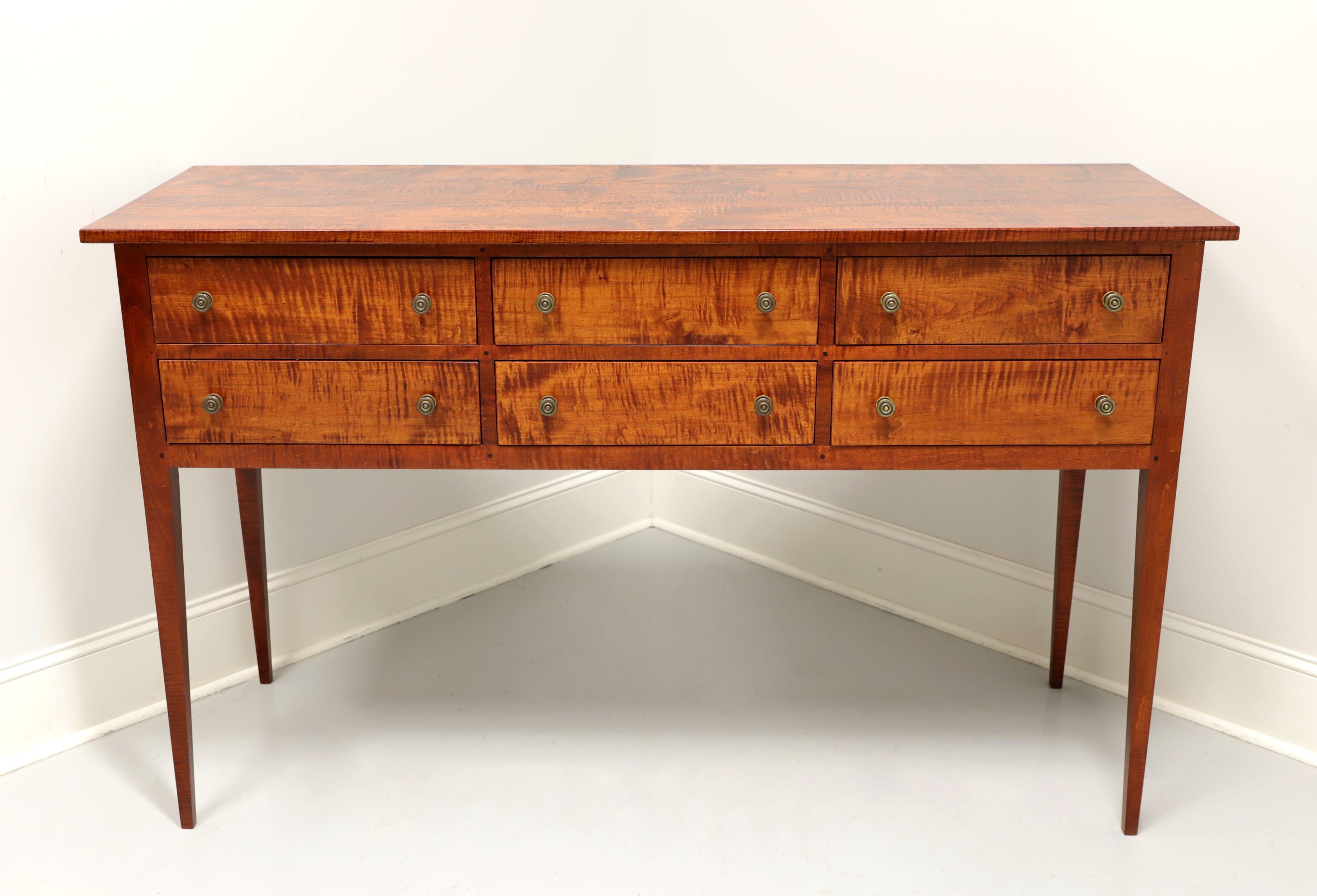 A Traditional style huntboard by JL Treharn. Solid tiger maple with brass hardware and straight tapered legs. Features six drawers of dovetail construction. Made in Ohio, USA, in the late 20th Century.

Measures: 63.5 W 22 D 39 H

Excellent