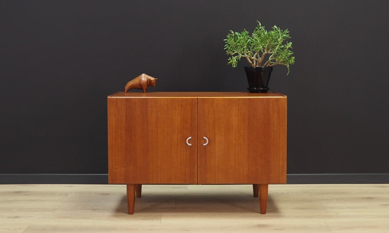 Phenomenal cabinet from the 1960s-1970s, Scandinavian design, minimalist form. Manufactured by ÆJM Møbler. Surface of the furniture is finished with teak veneer. Shelf in the interior. Maintained in good condition (minor bruises and