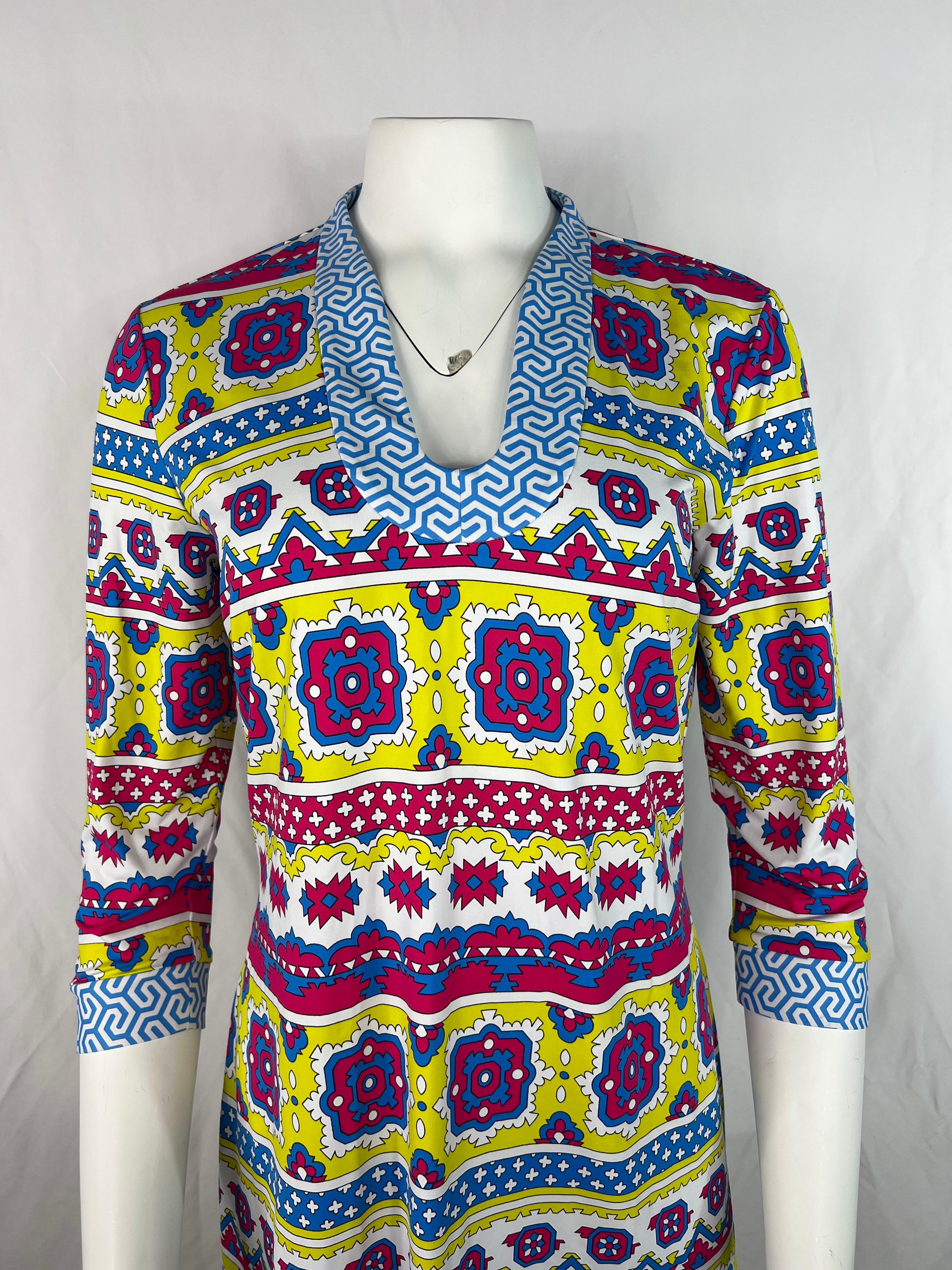 Product details:

The dress features pink, blue, yellow and white colors, geometric pattern print, tunic style with 3/4 sleeve length.