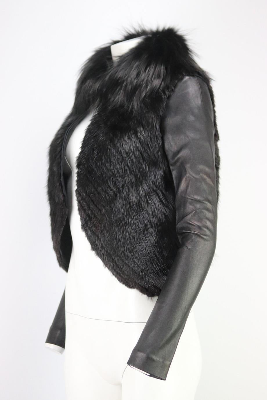 This cropped jacket by J.Mendel adds a bit of edge to any outfit with the different textures, it been cut from black fox-fur body with fur trim and detachable stretch-leather arms with asymmetric hem. Black leather, black fur. Hook and eye fastening