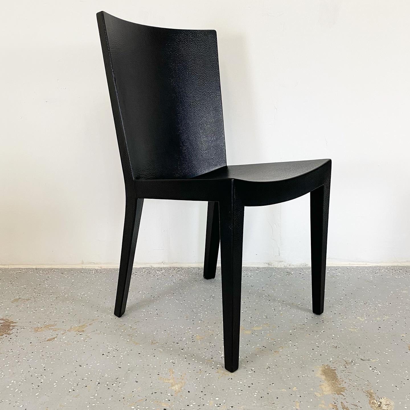 A stunning restored set of Jean-Michel Frank Chairs by Karl Springer. These have reptile skin stamped leather, newly refinished with a matte black lacquer.