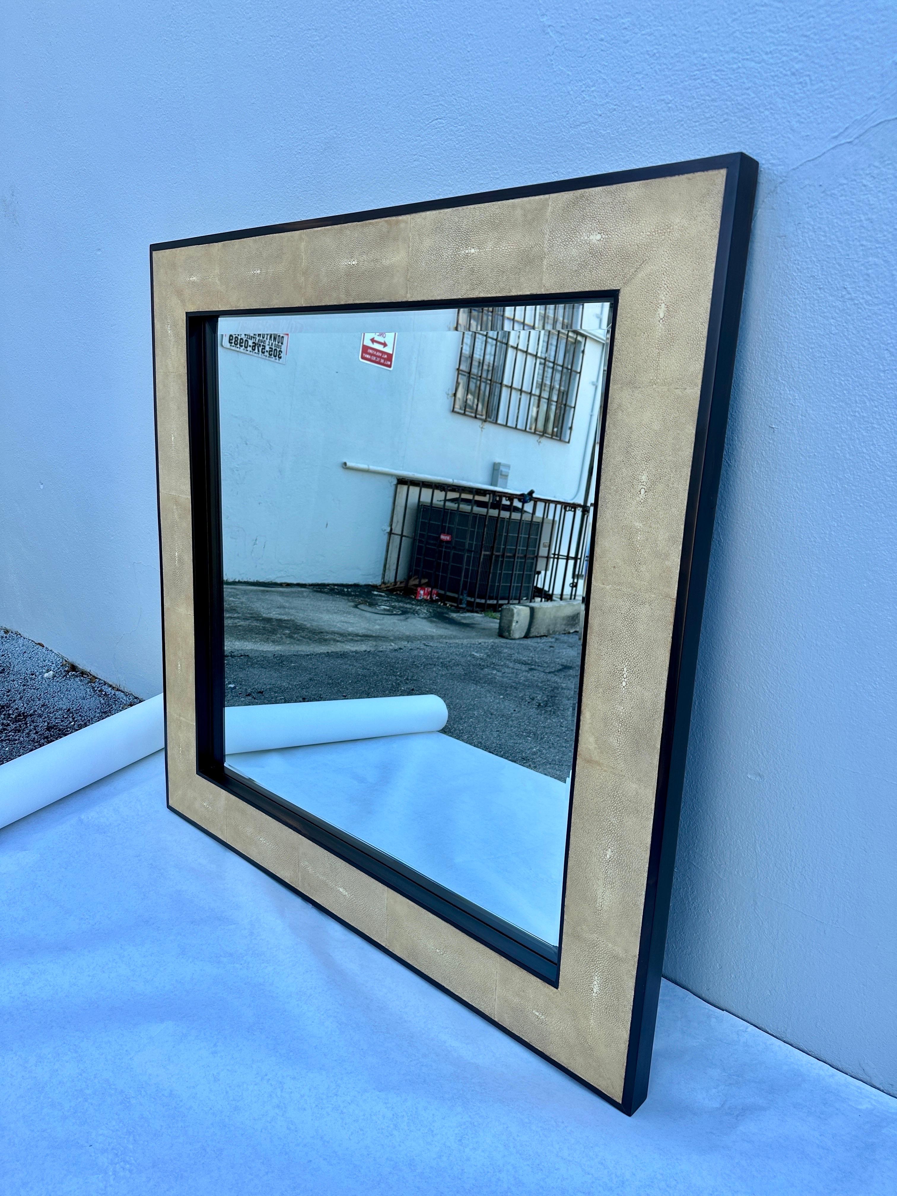 A beautiful cream toned shagreen skin frame on mahogany wood and beveled mirror. Perfect 42 inch square, heavy and important piece by Ron Seff.  THIS ITEM IS LOCATED AND WILL SHIP FROM OUR MIAMI, FLORIDA SHOWROOM.