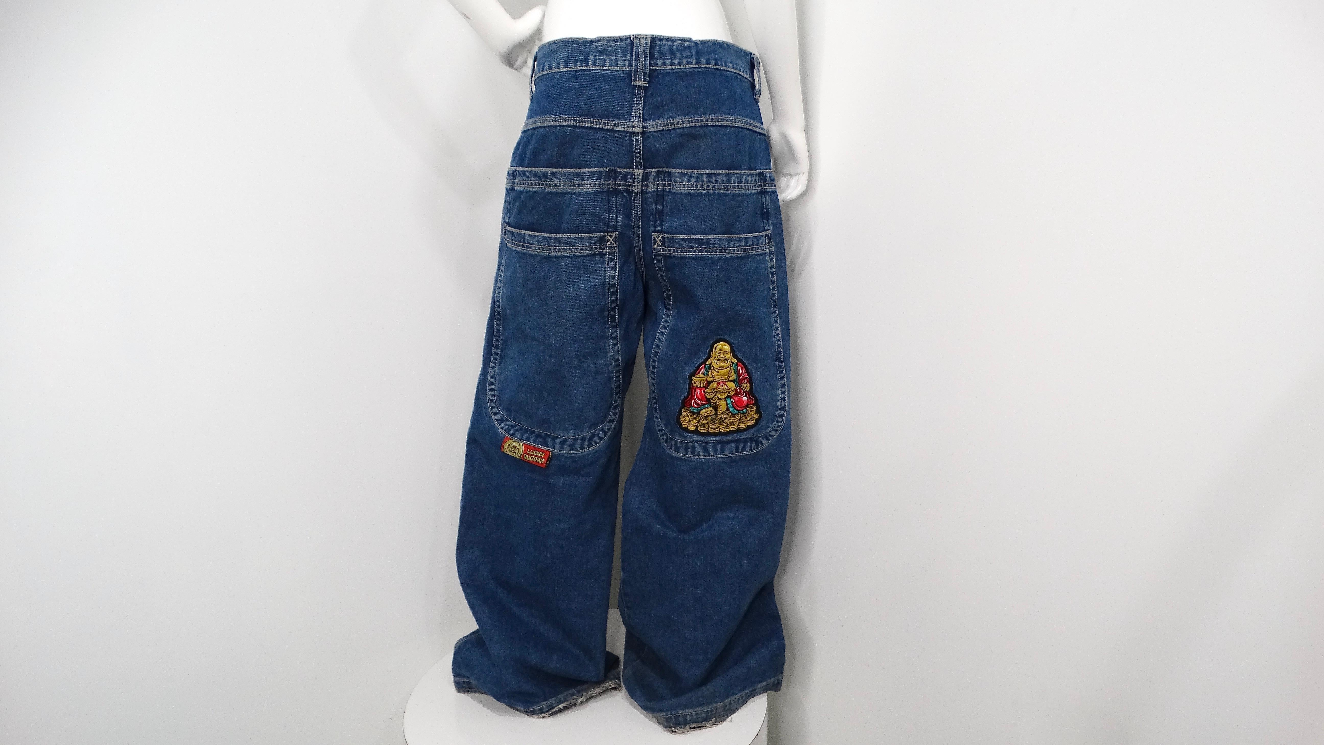 Introducing the JNCO Lucky Buddha Limited Edition Dark Stone Blue Denim Baggy Jeans, a unique blend of style and comfort. Crafted with high-quality denim, these jeans feature the brand's signature Buddha patch prominently displayed on the back