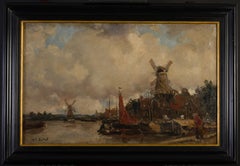 Dutch canal landscape with windmills.