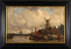 Paisaje de canal holandés con molinos de viento.