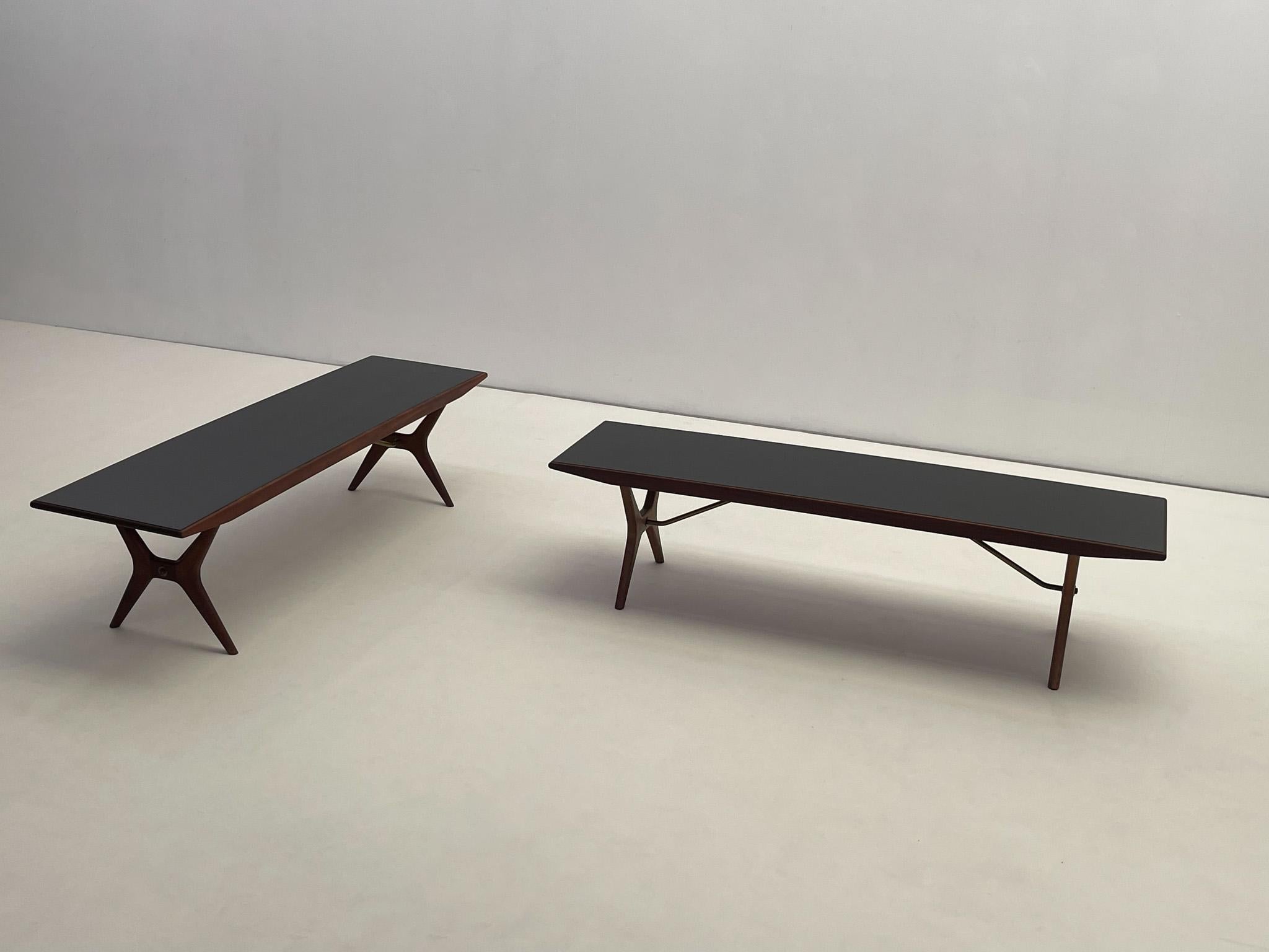 Vintage 1960s Jo Carlsson Swedish Modern coffee table crafted in teak with a sleek black Formica top and elegant brass details. This mid-century piece combines durability with timeless Scandinavian style, perfect as a functional accent in any modern