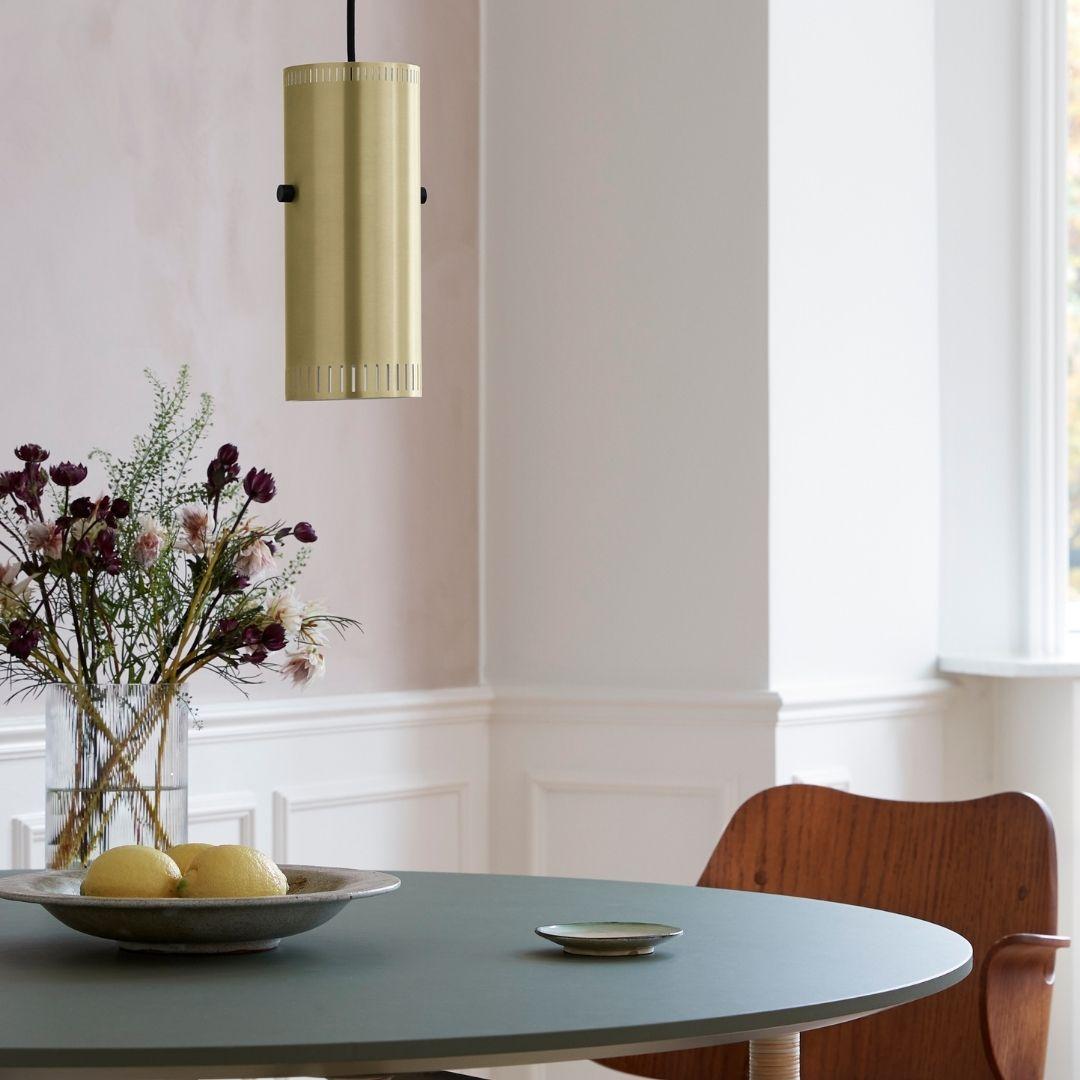 Jo Hamburg 'Trombone' pendant lamp in brass for Warm Nordic.

Founded in 2018, Warm Nordic combines minimalist Scandinavian design principles with a focus on creating warm and inviting living spaces. With design history, quality, and personality