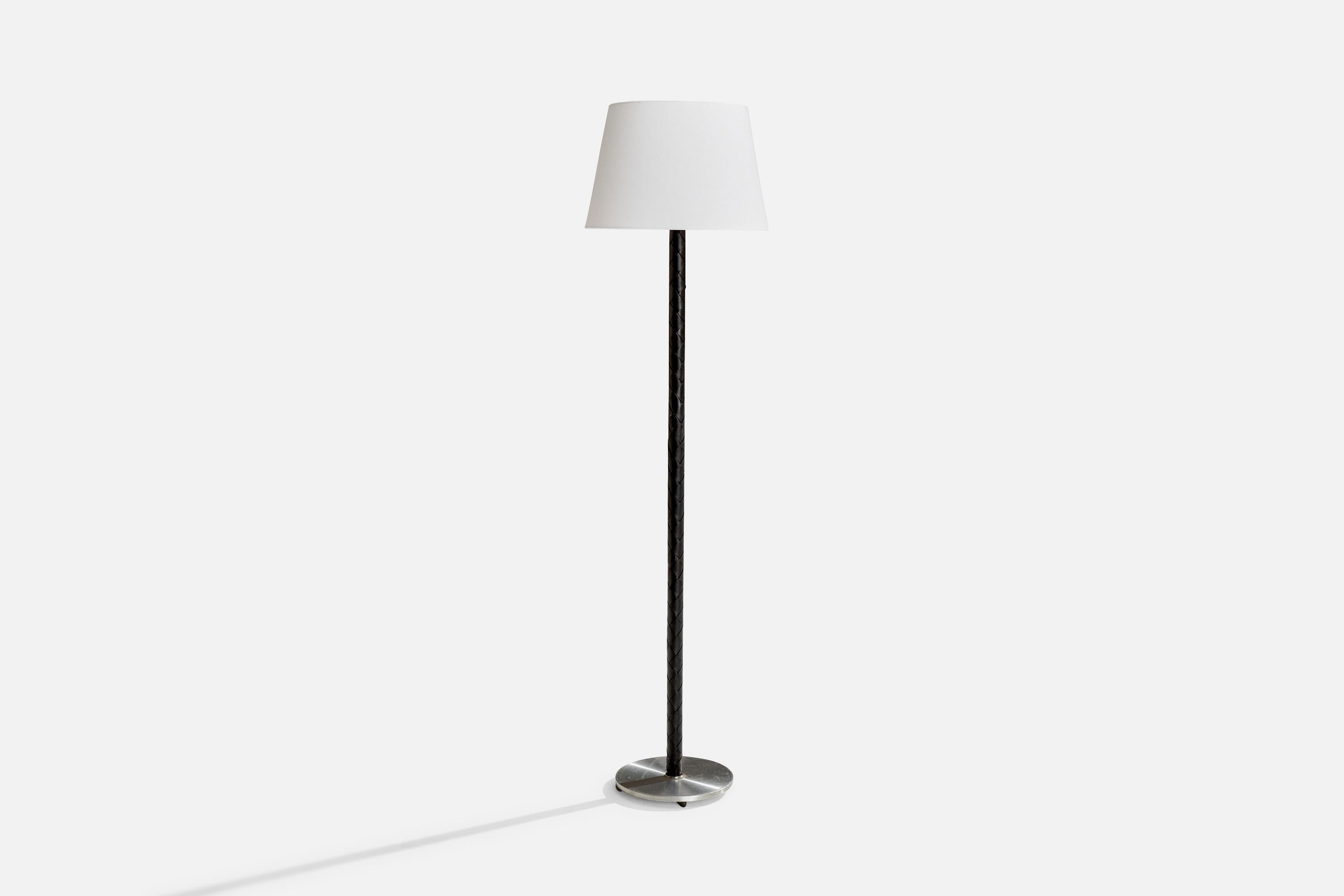 A steel, fabric and braided black leather floor lamp designed by Jo Hammerborg and produced by Fog & Mørup, Denmark, 1960s.

Overall Dimensions (inches): 62.5” H x 16” W x 16” D
Stated dimensions include shade.
Bulb Specifications: E-26 Bulb
Number