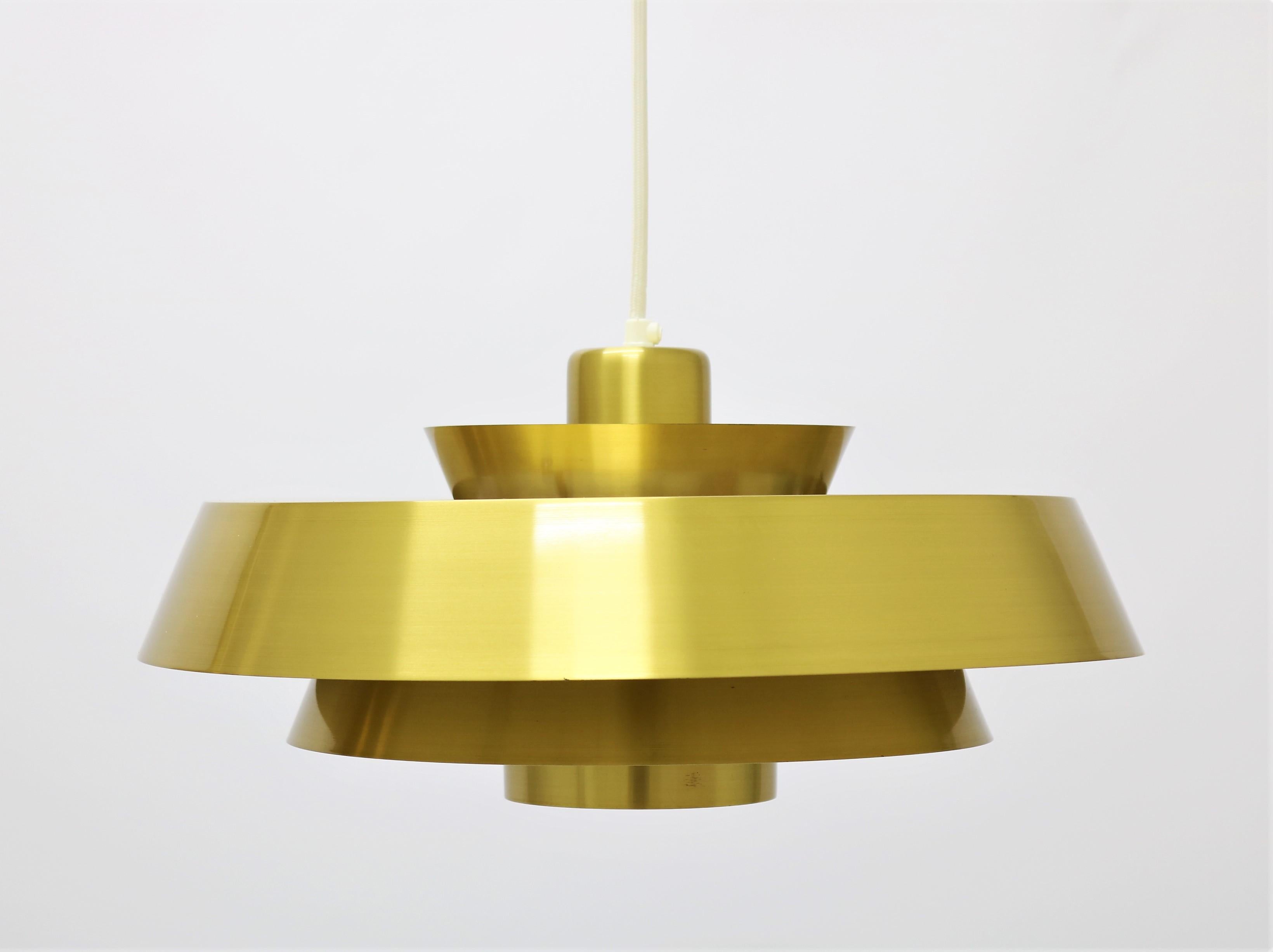 Wonderful pair of Scandinavian Modern brass pendants by Danish designer Jo Hammerborg. Made in the 1960s for renown manufacturer Fog & Mørup. The lamps are made from high quality solid brass and lacquered on the inside.