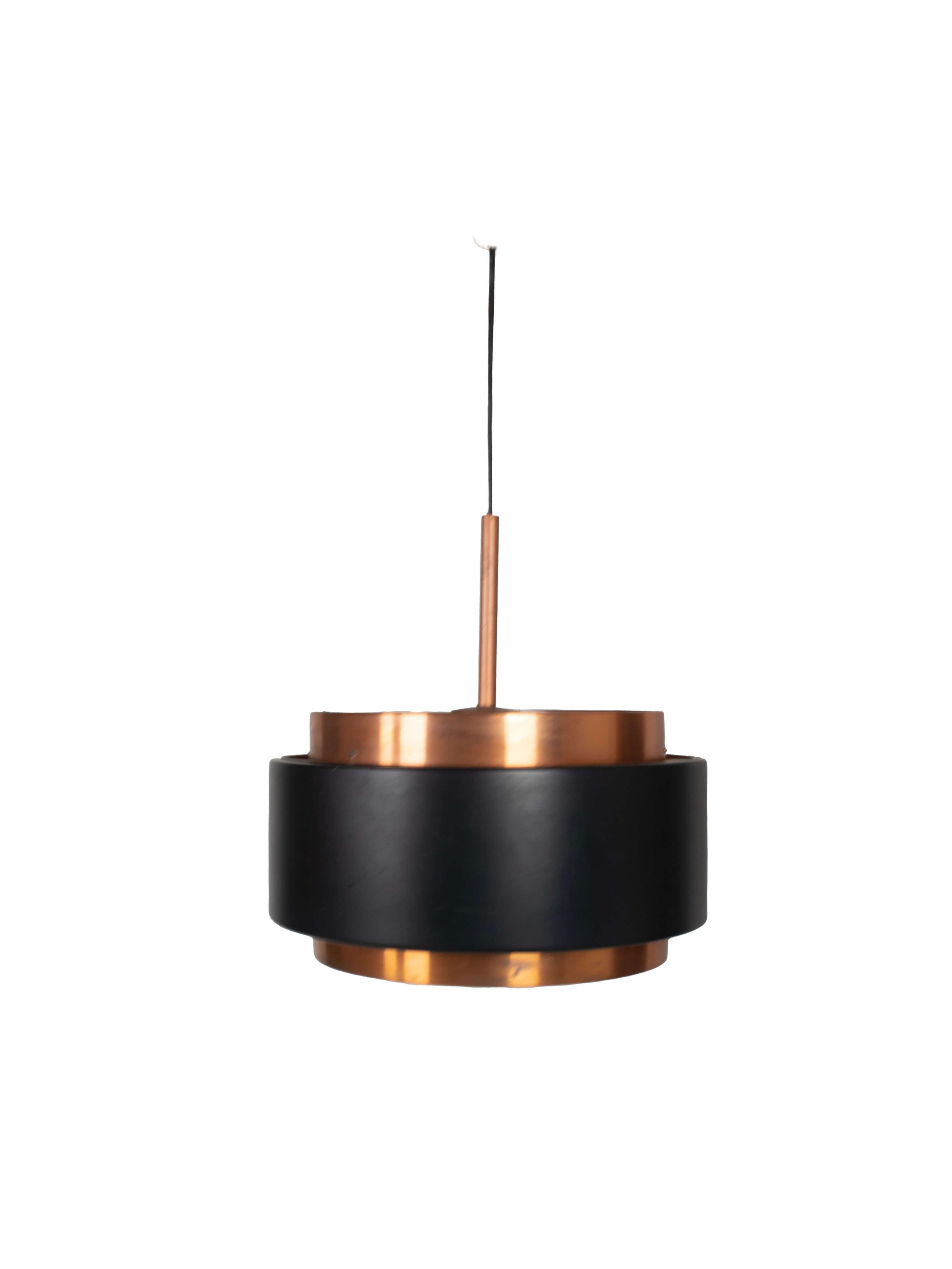 Nice Jo Hammerborg Saturn Hanging Lamp for Fog & Mørup, Denmark, 1950s. This pendant has two concentric cylindrical copper bands, held together by a black lacquered band. At the top and the bottom, the lamp is closed by two acrylic plates that