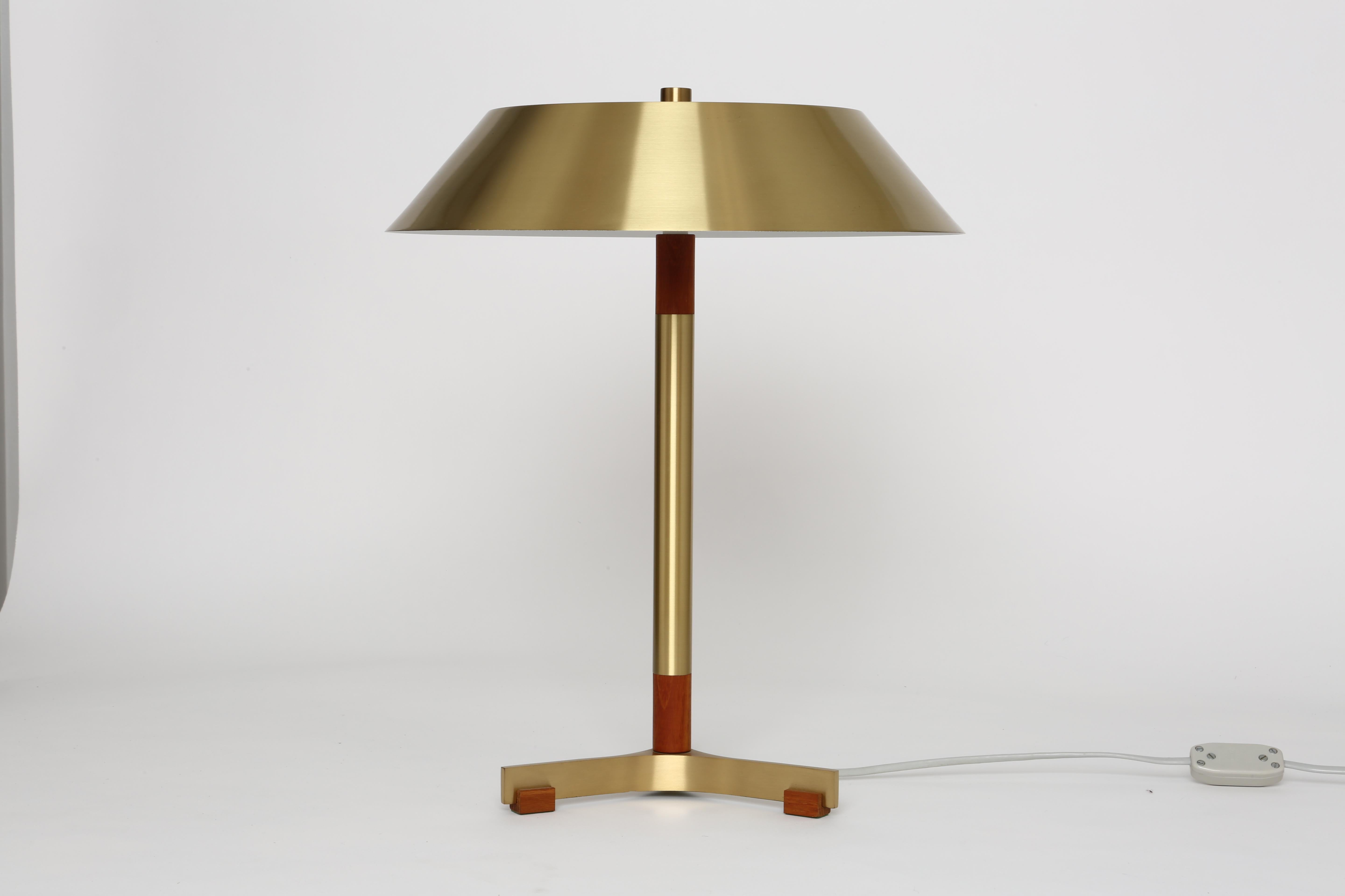 Table lamp by Jo Hammerborg for Fog & Morup.
Model President. Made of brass and teak.
Has two medium base sockets.