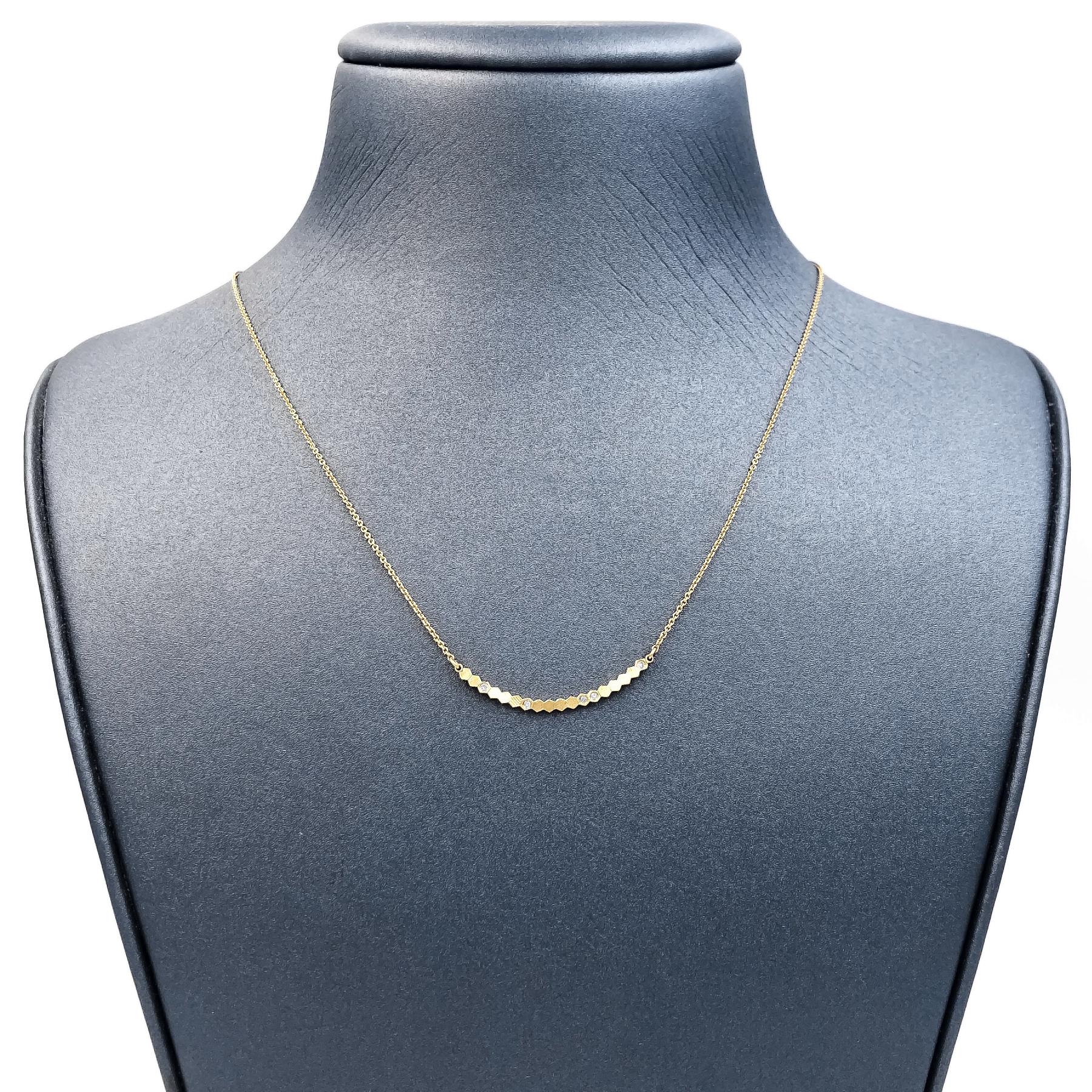 Curved Bar Necklace handcrafted in London by jewelry maker Jo Hayes Ward in her signature-finished reflective 18k yellow gold featuring five bezel-set round brilliant-cut white diamonds totaling 0.03 carats, on an 18k yellow gold 16 inch chain with