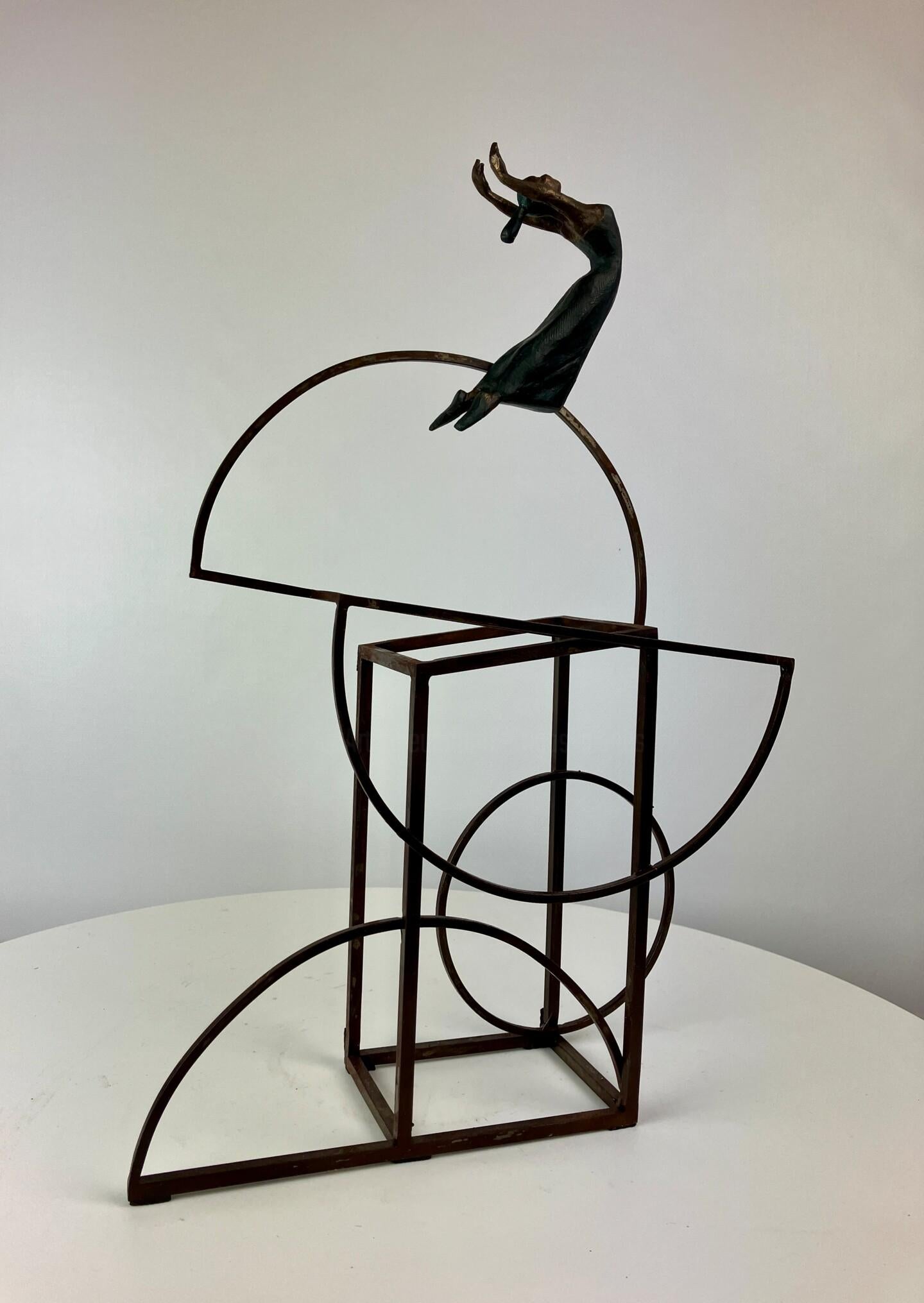 Bauhus II is a bronze sculpture with black patina, it is connected to a steel base. The edition size is 25. This sculpture stands on shelf as well as be hung on wall. Joan wants to depict the sense of freedom and free will by capturing the flying
