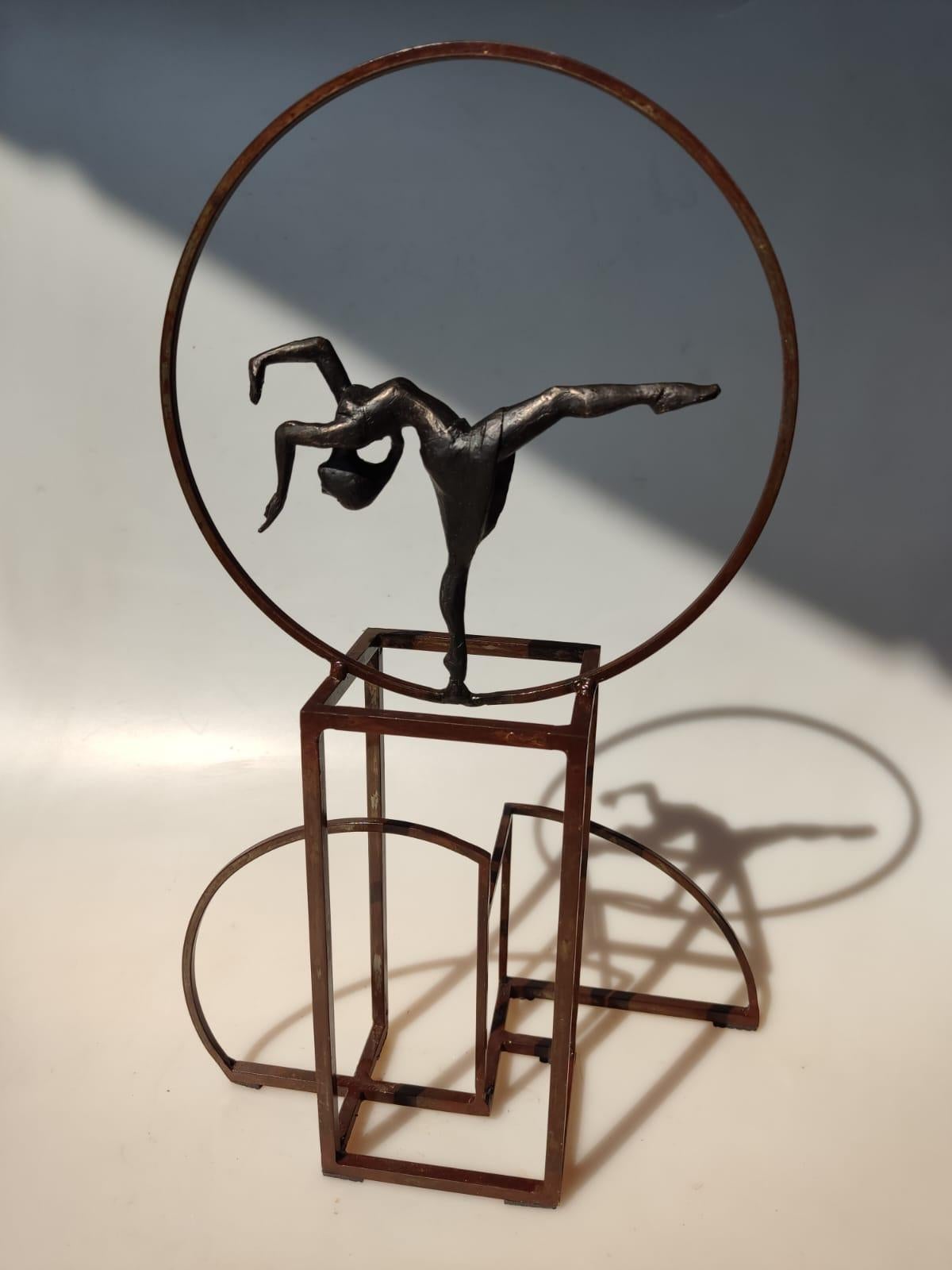 Isadora II is a bronze sculpture with black patina, it is connected to a steel base. The edition size is 25. This sculpture stands on shelf as well as be hung on wall. Joan pays tribute to ballerina Isadora Duncan.

Joan’s latest sculpture series of